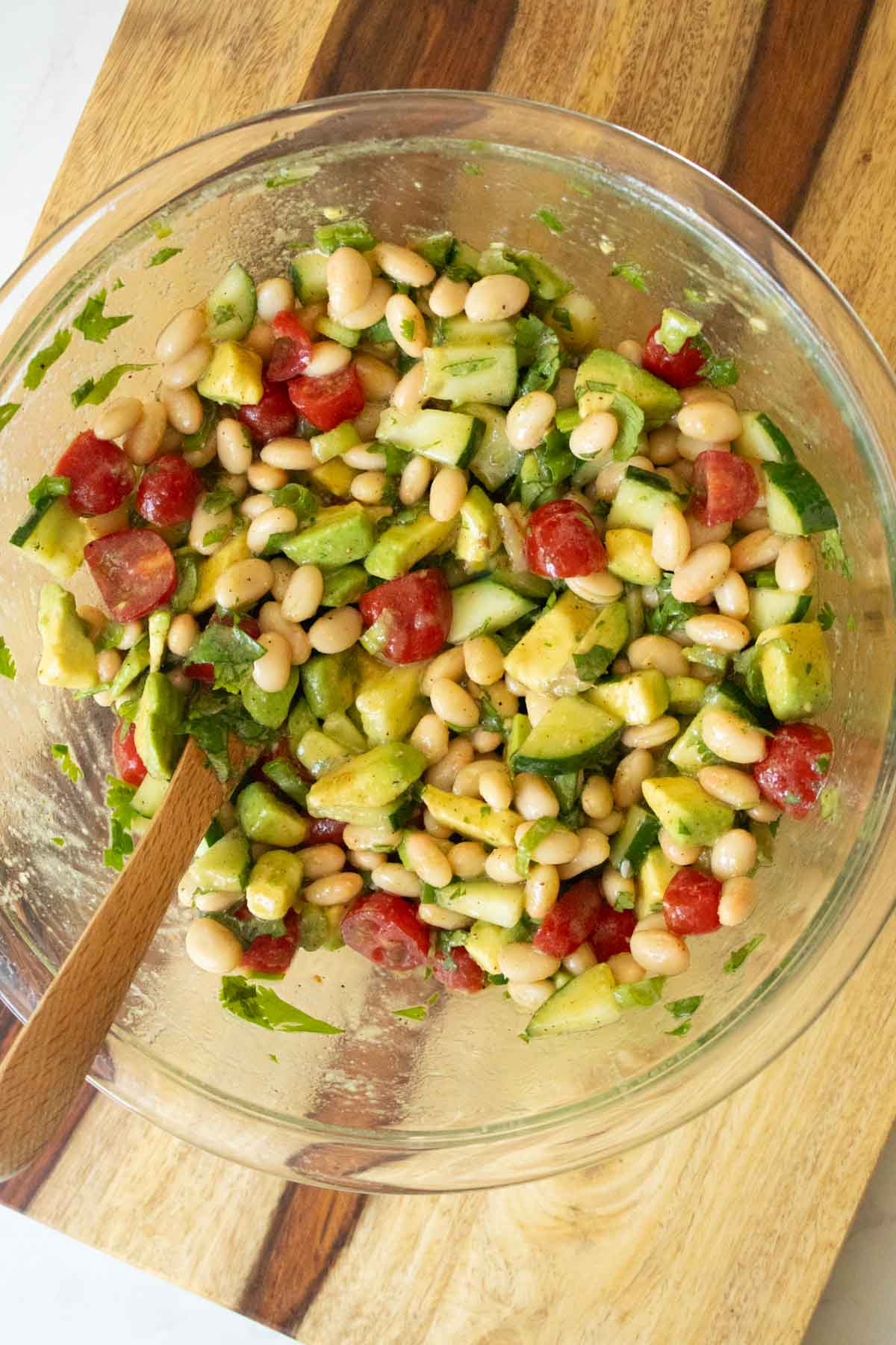 avocado white bean salad after tossing together in the mixing bowl
