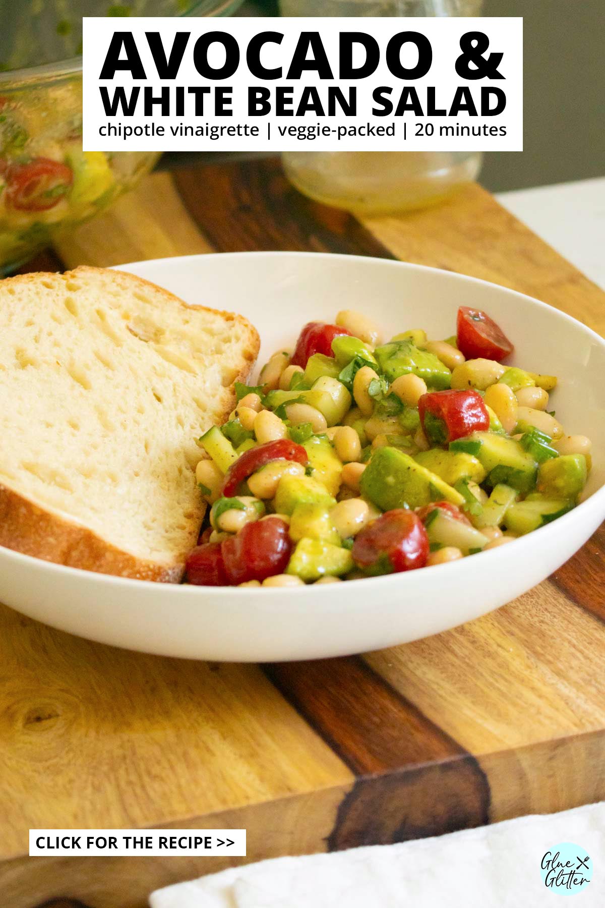 bowl of avocado white bean salad with toast to dip, serving bowl in the background, text overlay