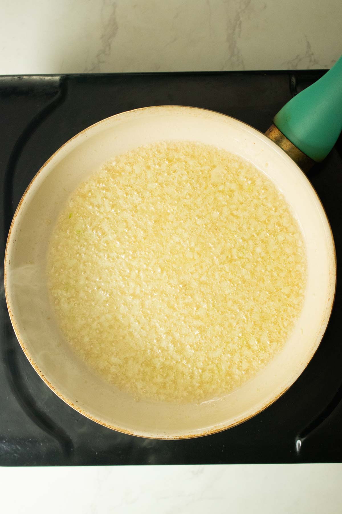 garlic in the pan before cooking