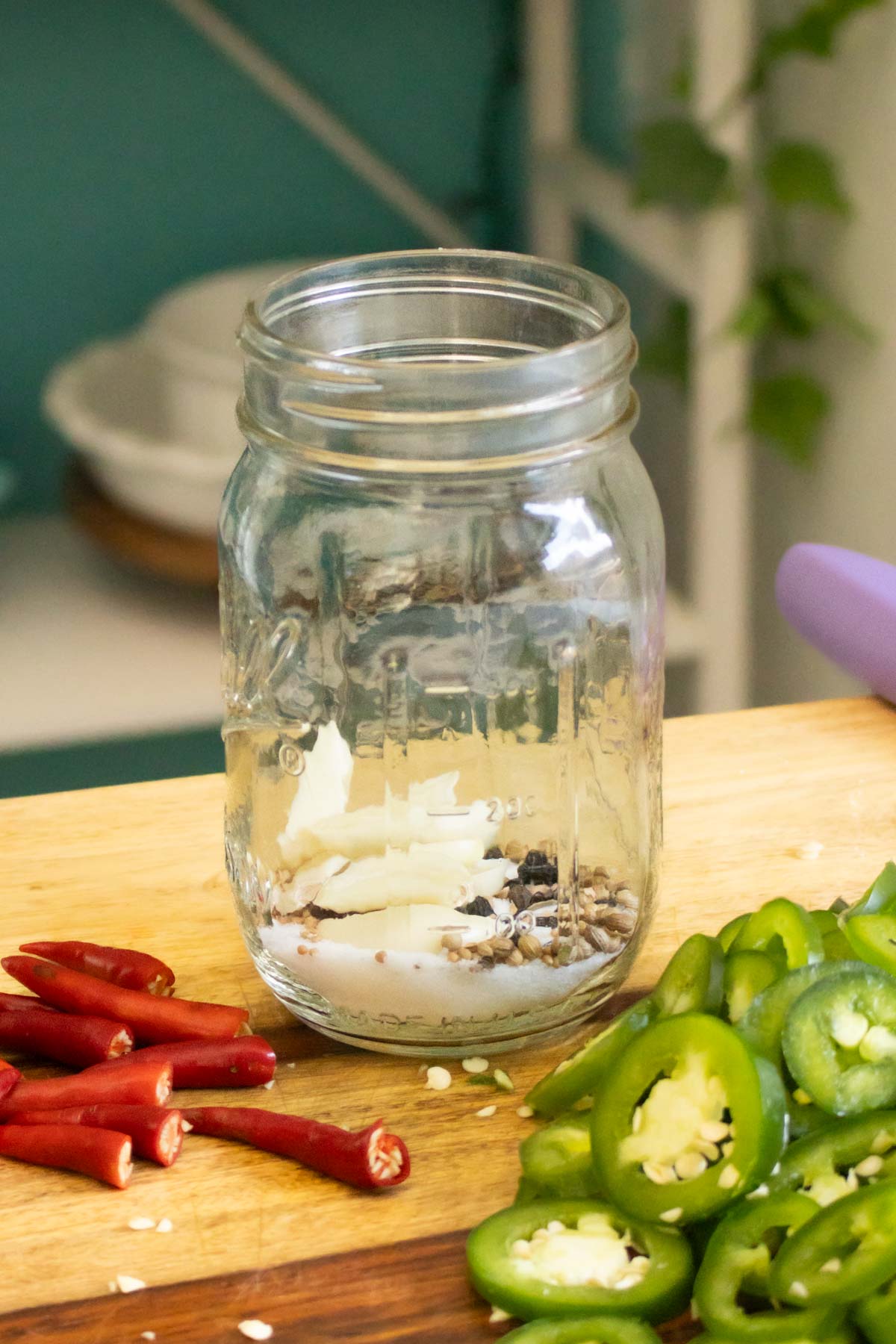 sugar, salt, garlic, and pickling spices in the jar