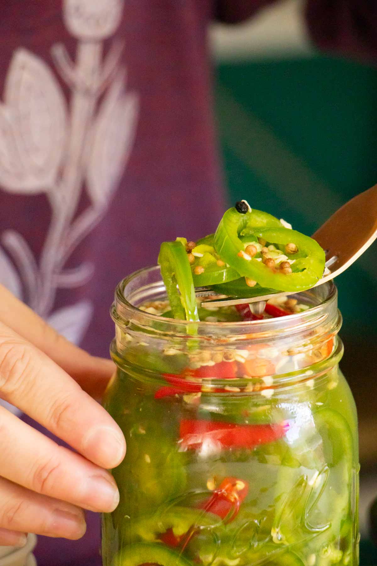 fork serving some pickled chilies from the jar