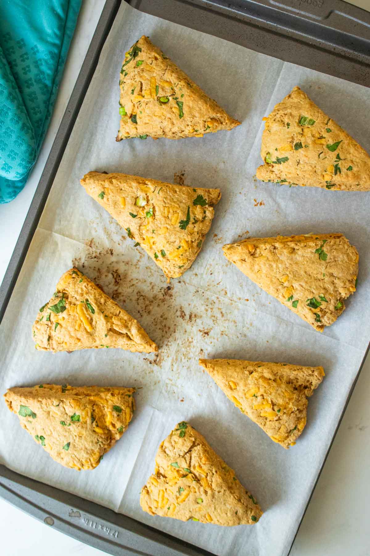 savory vegan scones on the baking sheet after baking