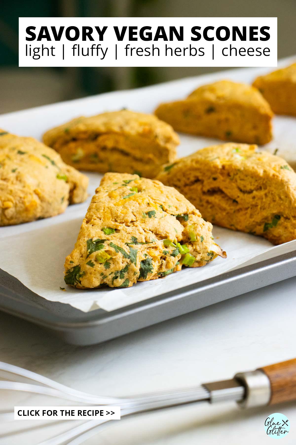 close-up of a savory vegan scone on the baking sheet after baking, text overlay
