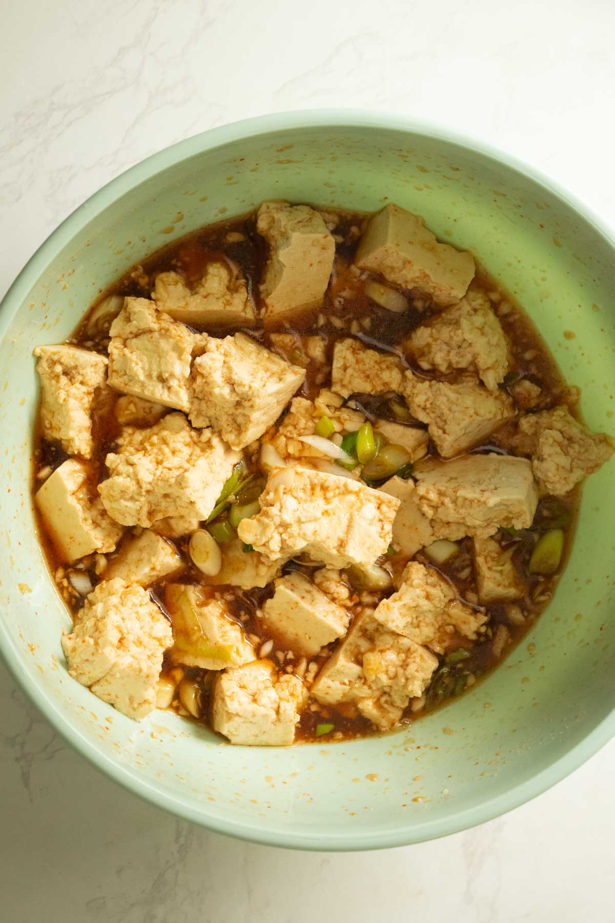 marinating tofu in the vegan honey garlic sauce