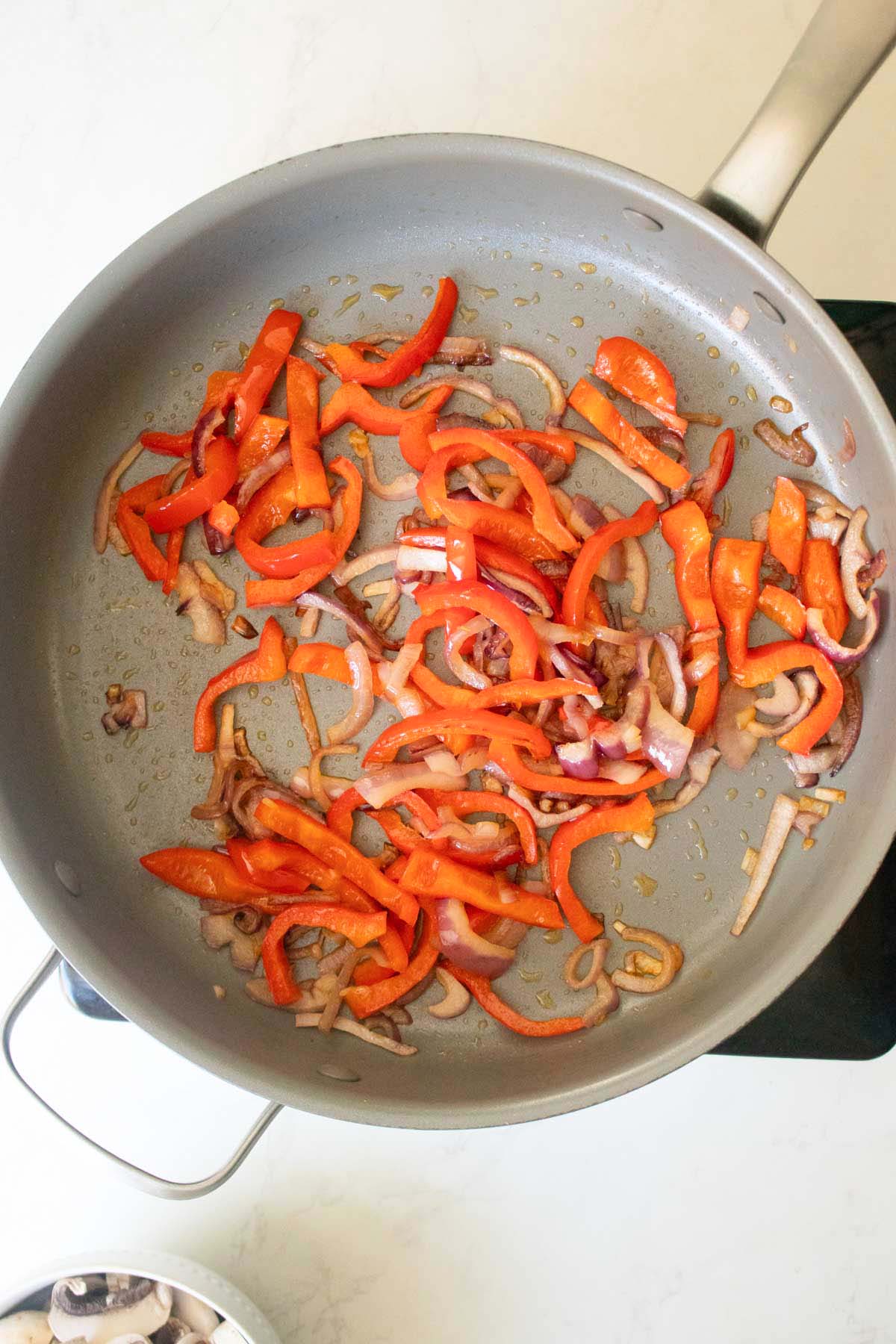 peppers and onions in the pan after cooking