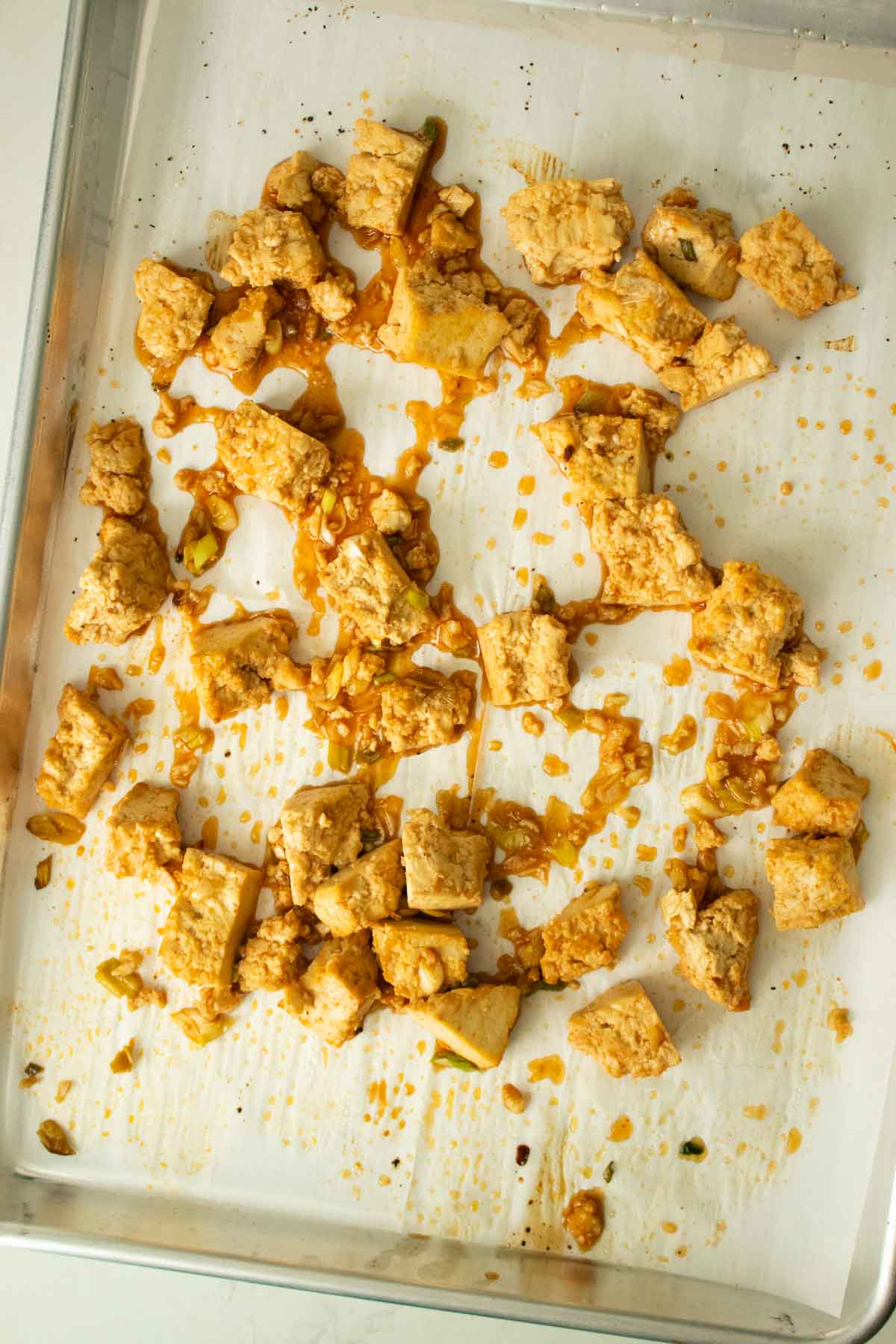 sheet pan honey garlic tofu before the second bake