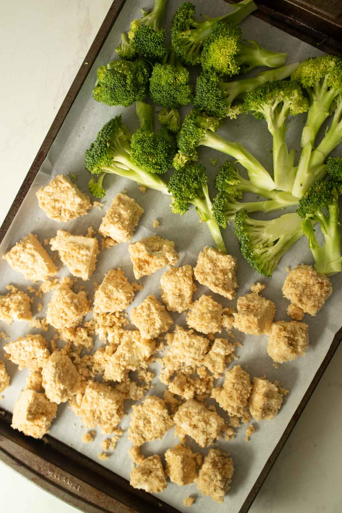 tofu and broccoli on the sheet pan