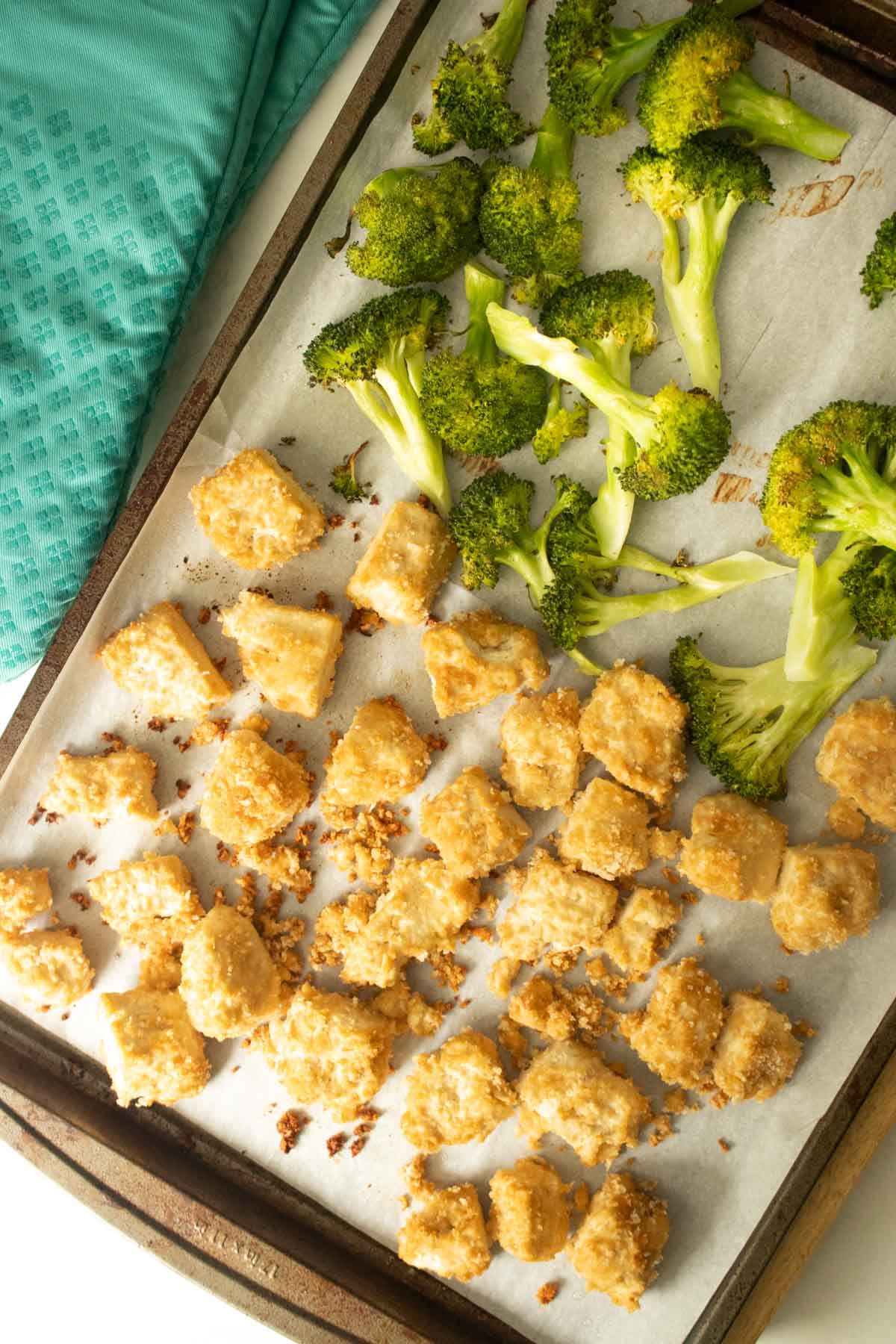 broccoli and tofu on the sheet pan after 20 minutes