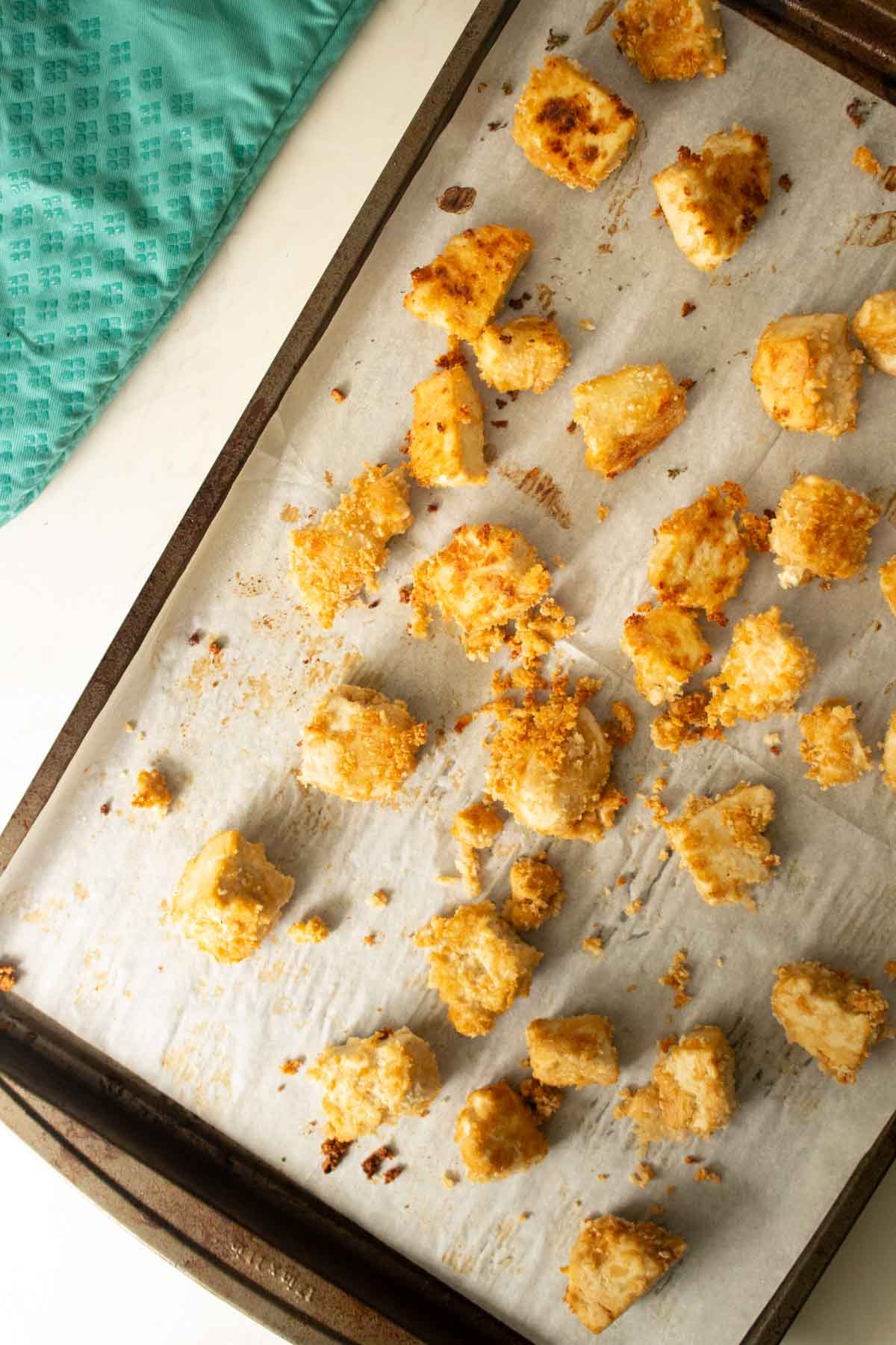 tofu spread out on the sheet pan