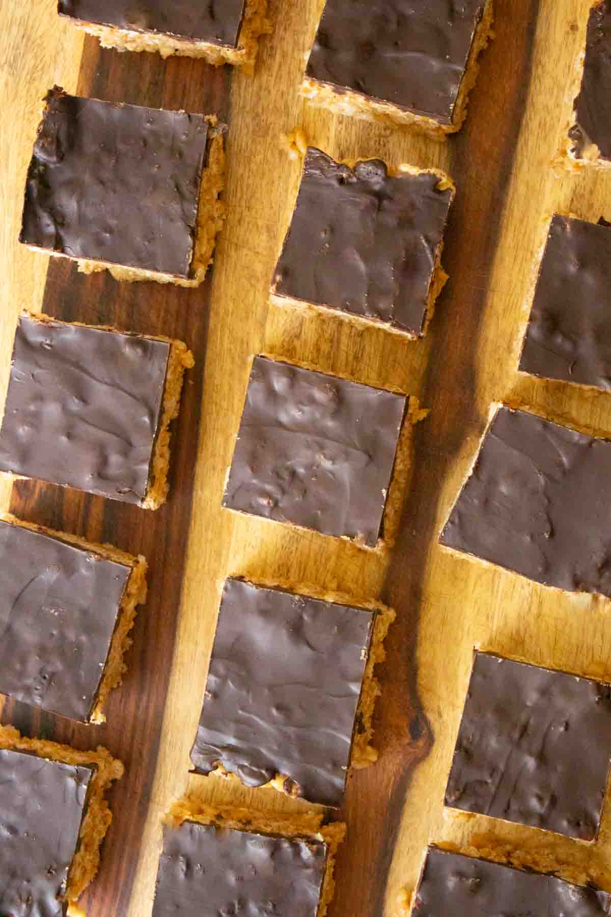 sliced peanut butter rice crispy treats on the cutting board