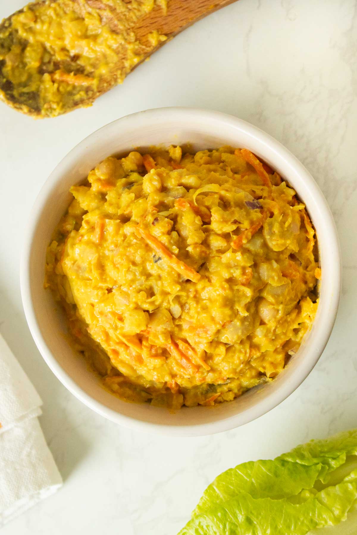 smashed white bean salad in a serving bowl