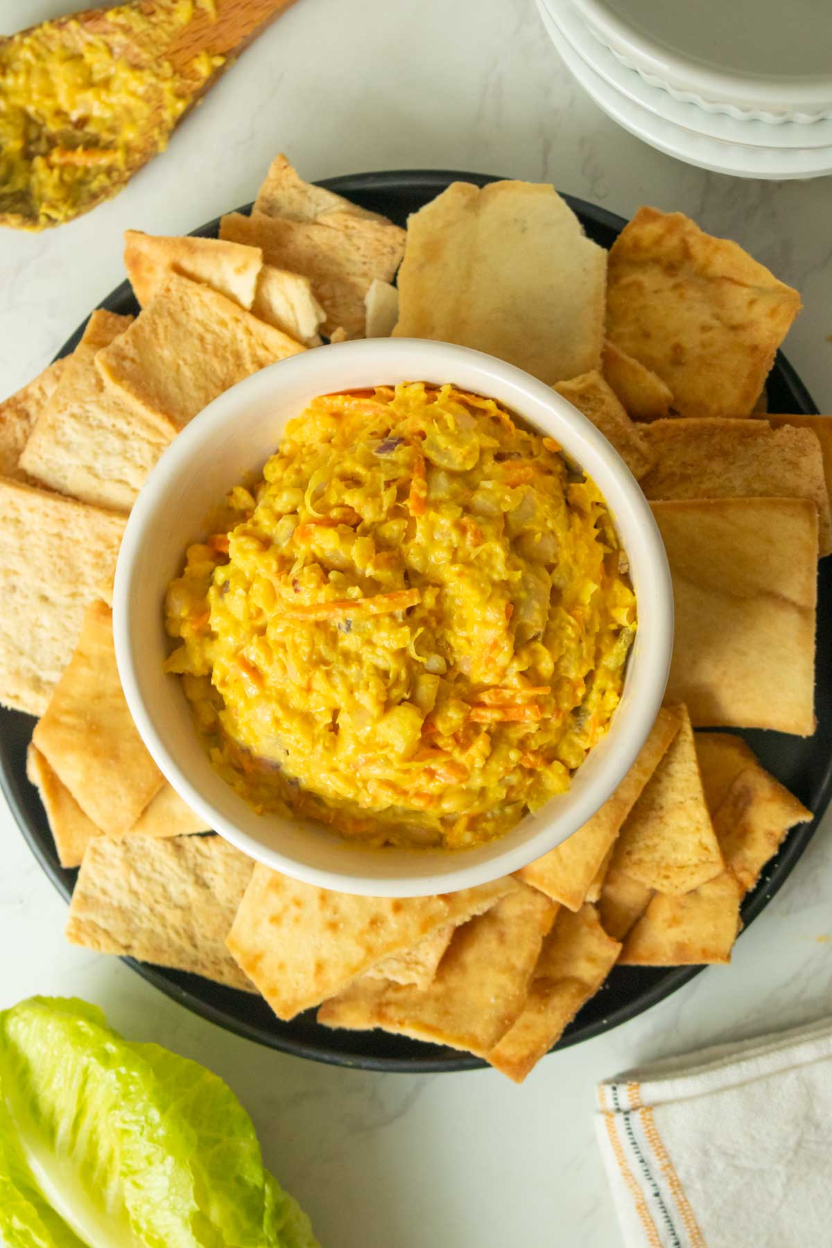 smashed white bean salad served with pita chips for dipping