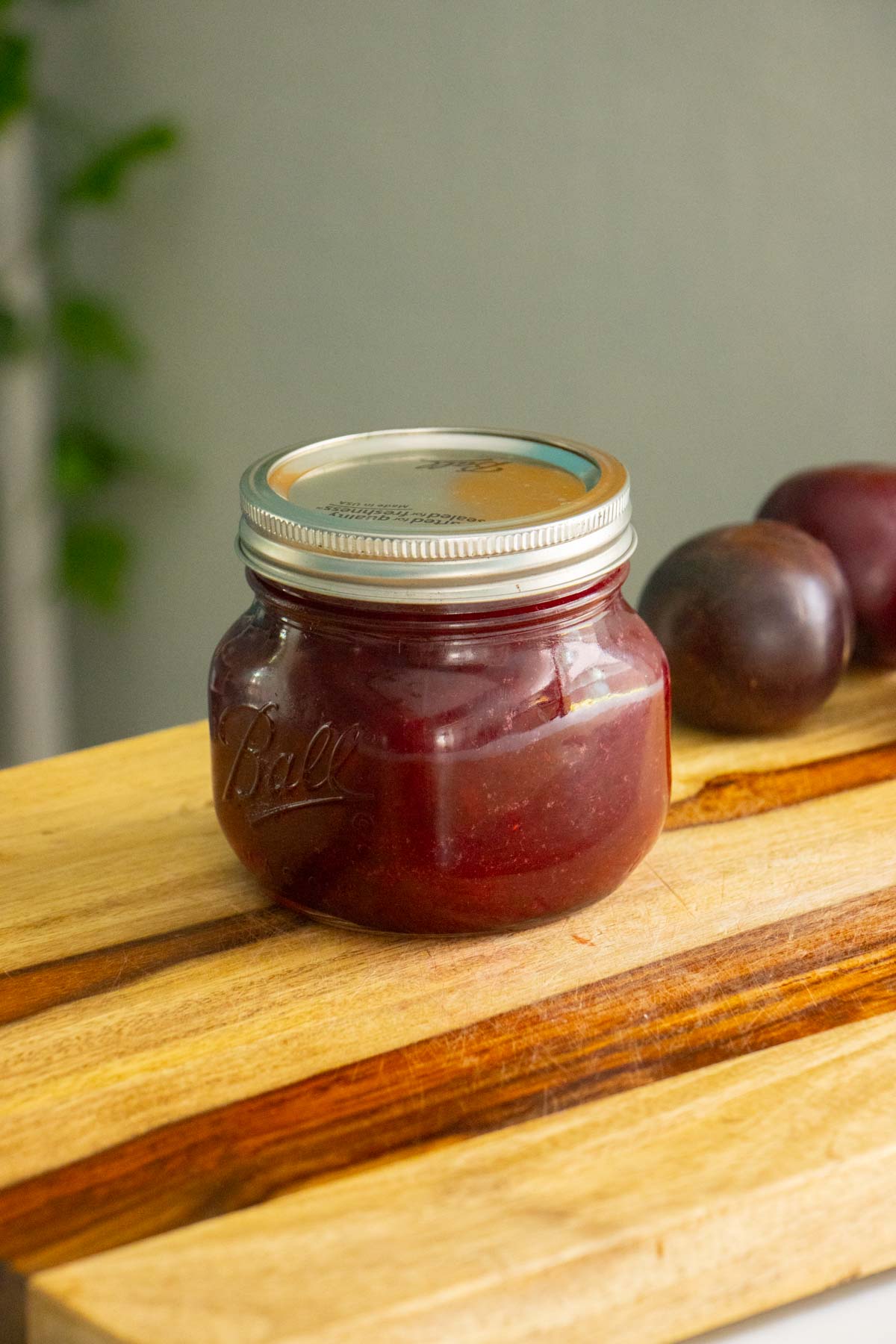 plum freezer jam with the lid on the jar