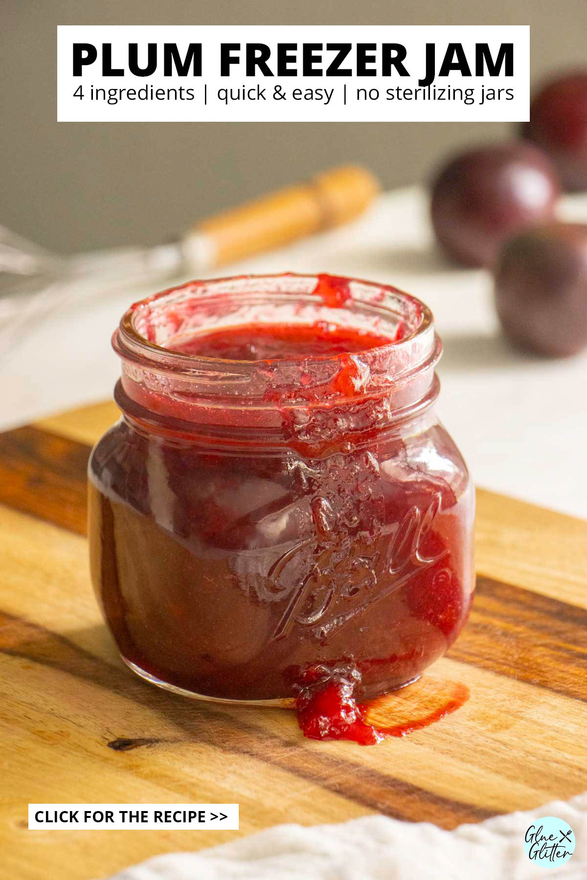 jar of plum freezer jam on a wooden cutting board, text overlay