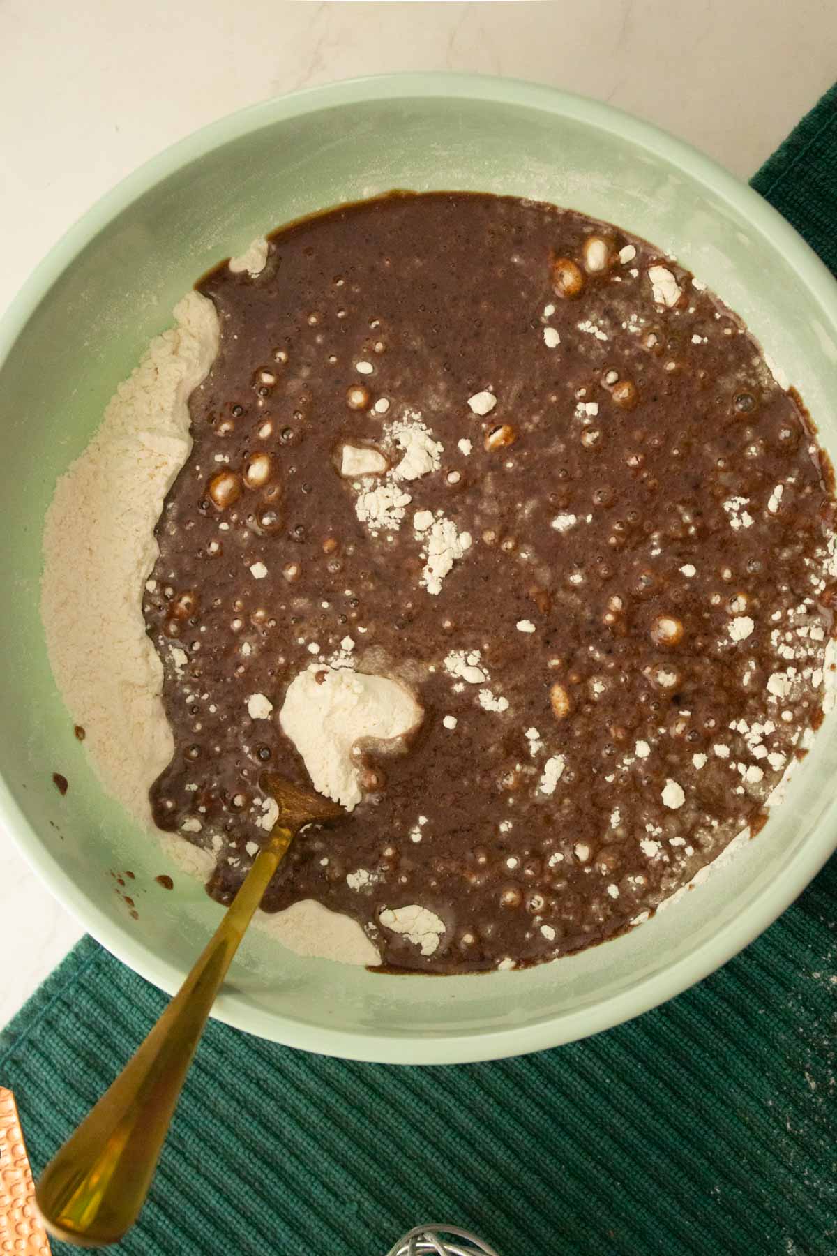 adding wet ingredients to the dry