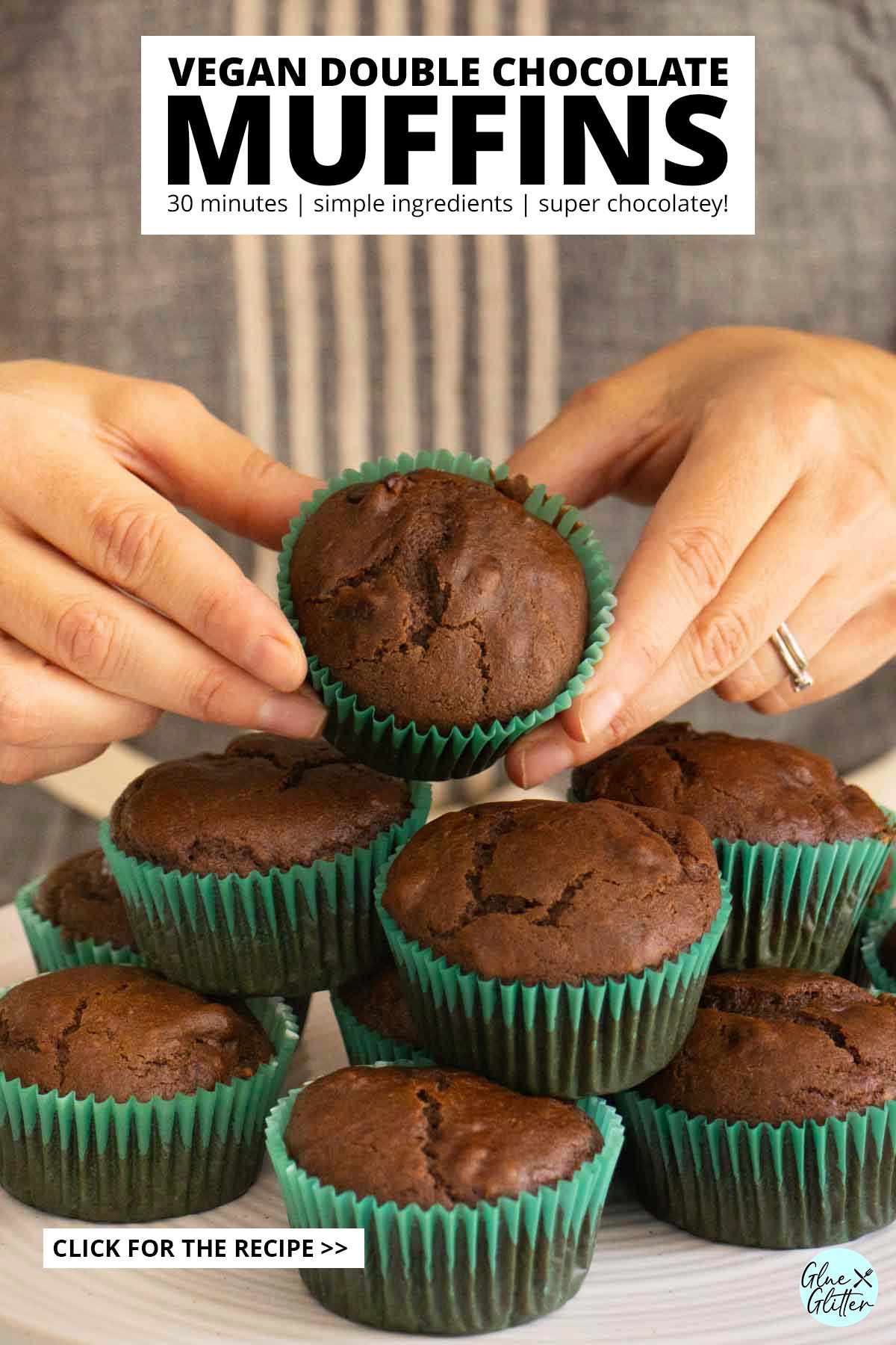 hands picking up a vegan double chocolate muffin from the serving tray, text overlay
