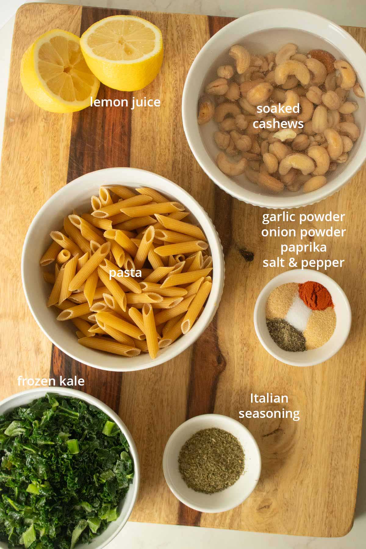 white pasta sauce ingredients on a wooden cutting board, text labels on each