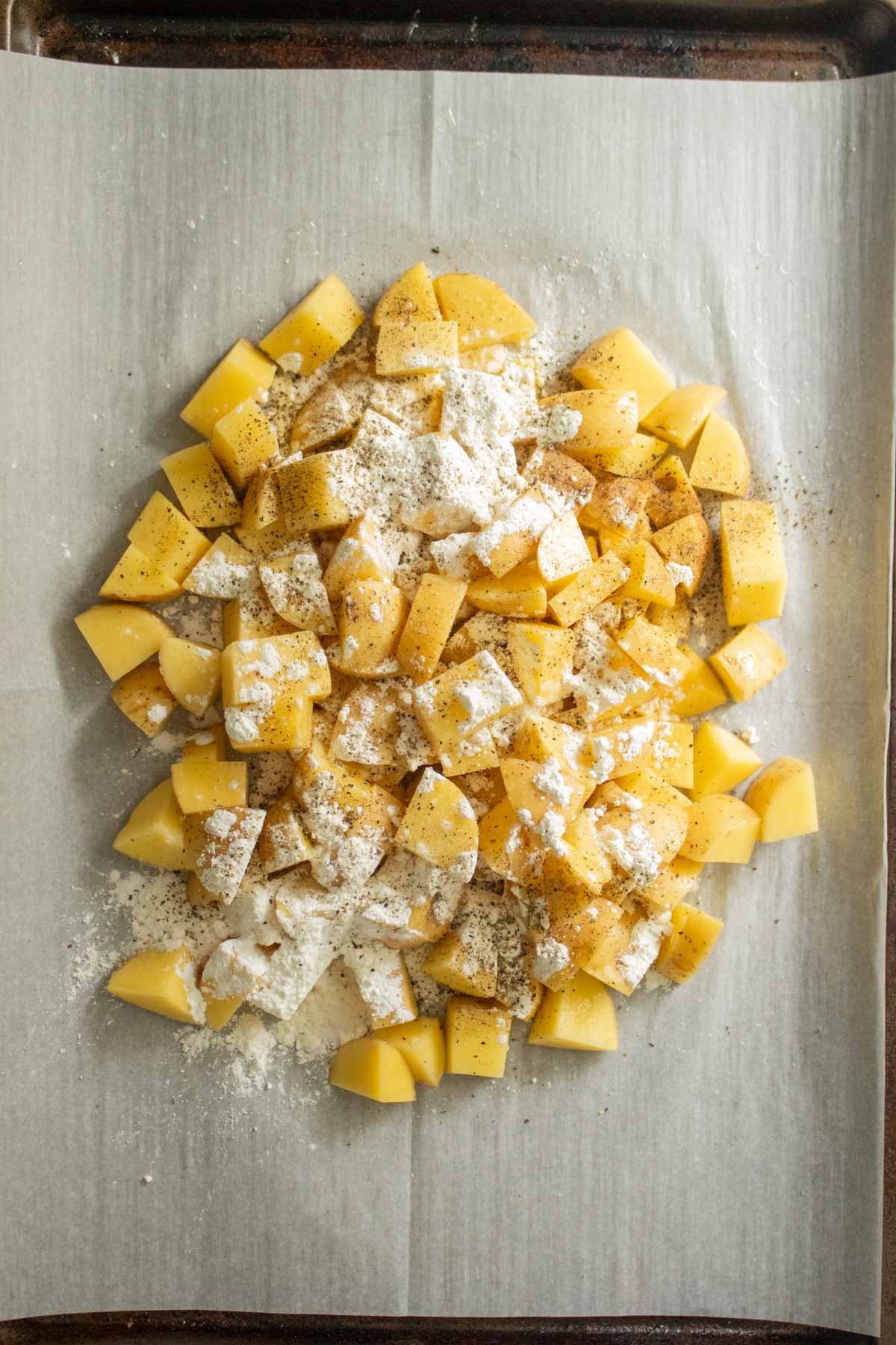potatoes, cornstarch, salt, and pepper before tossing together