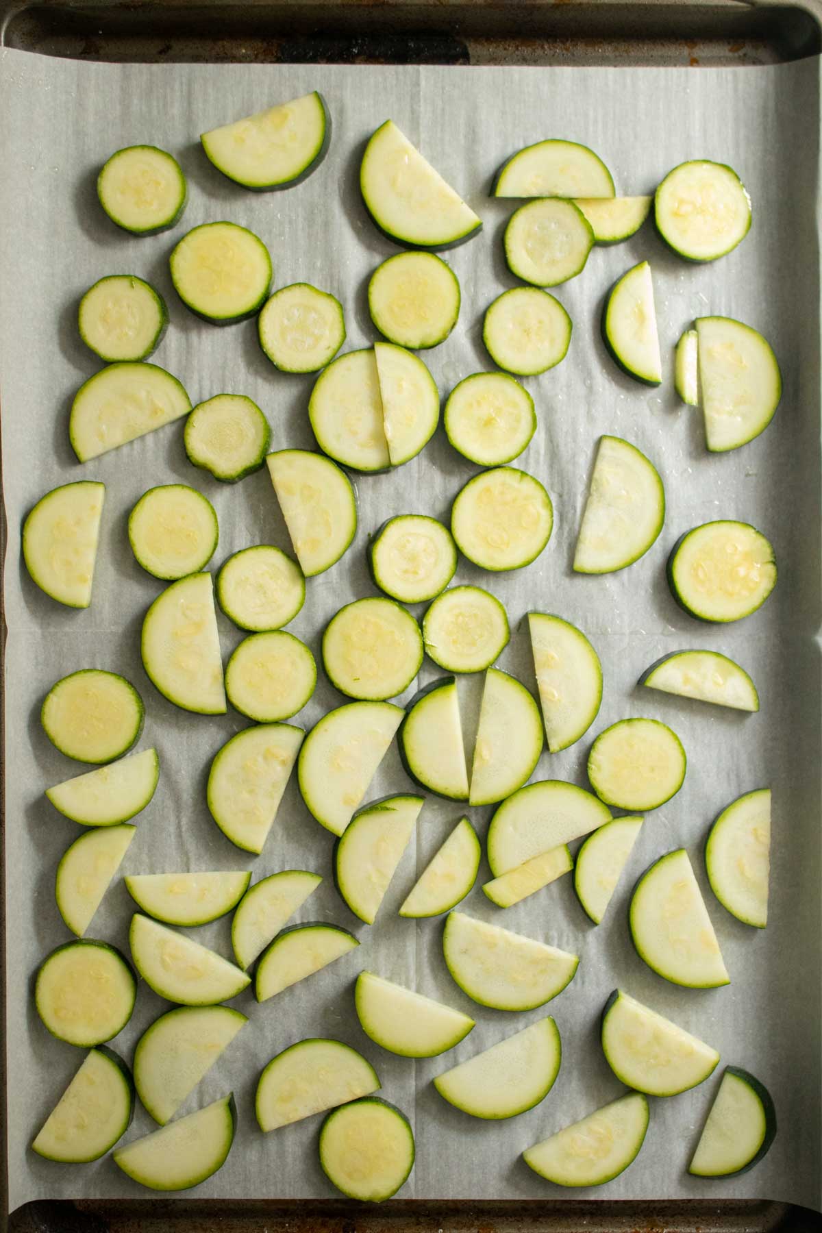 zucchini on the baking sheet before baking
