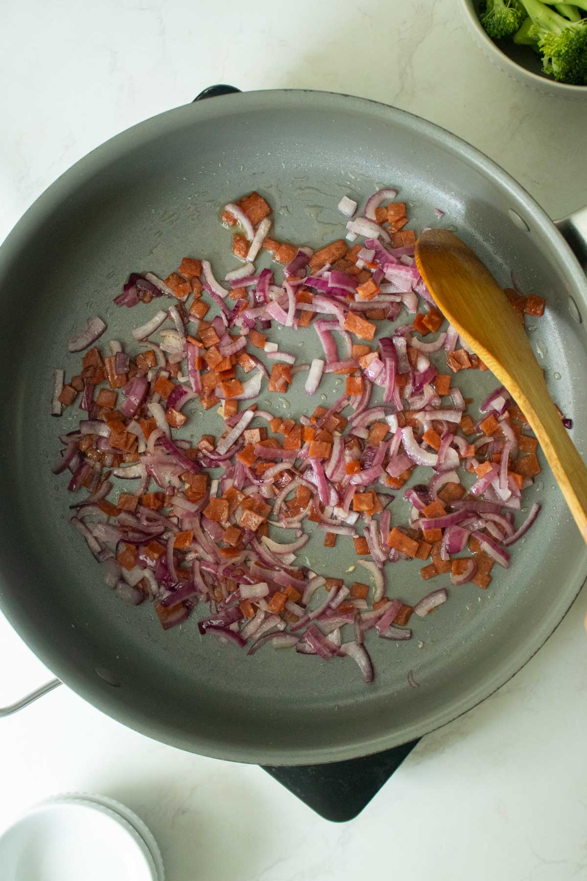 onions and bacon in the pan after cooking