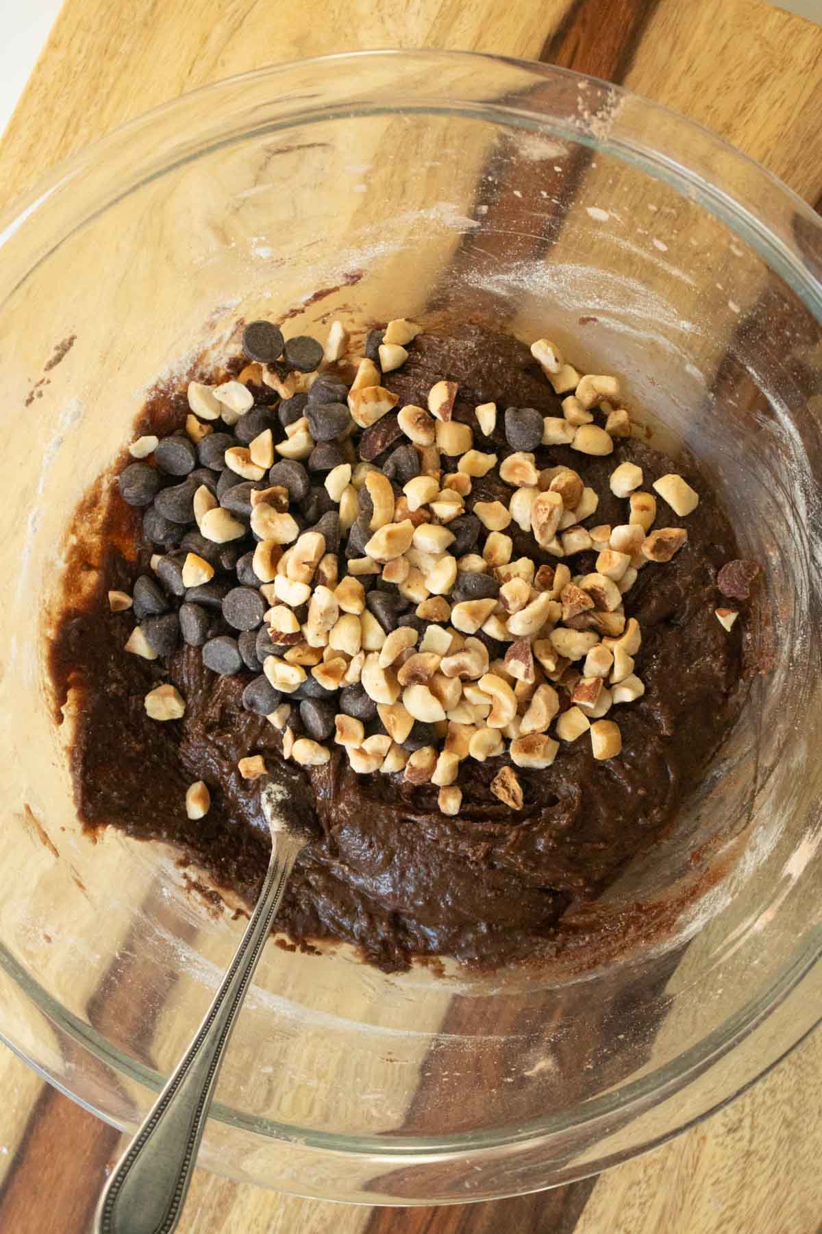 adding hazelnuts and chocolate chips to the batter
