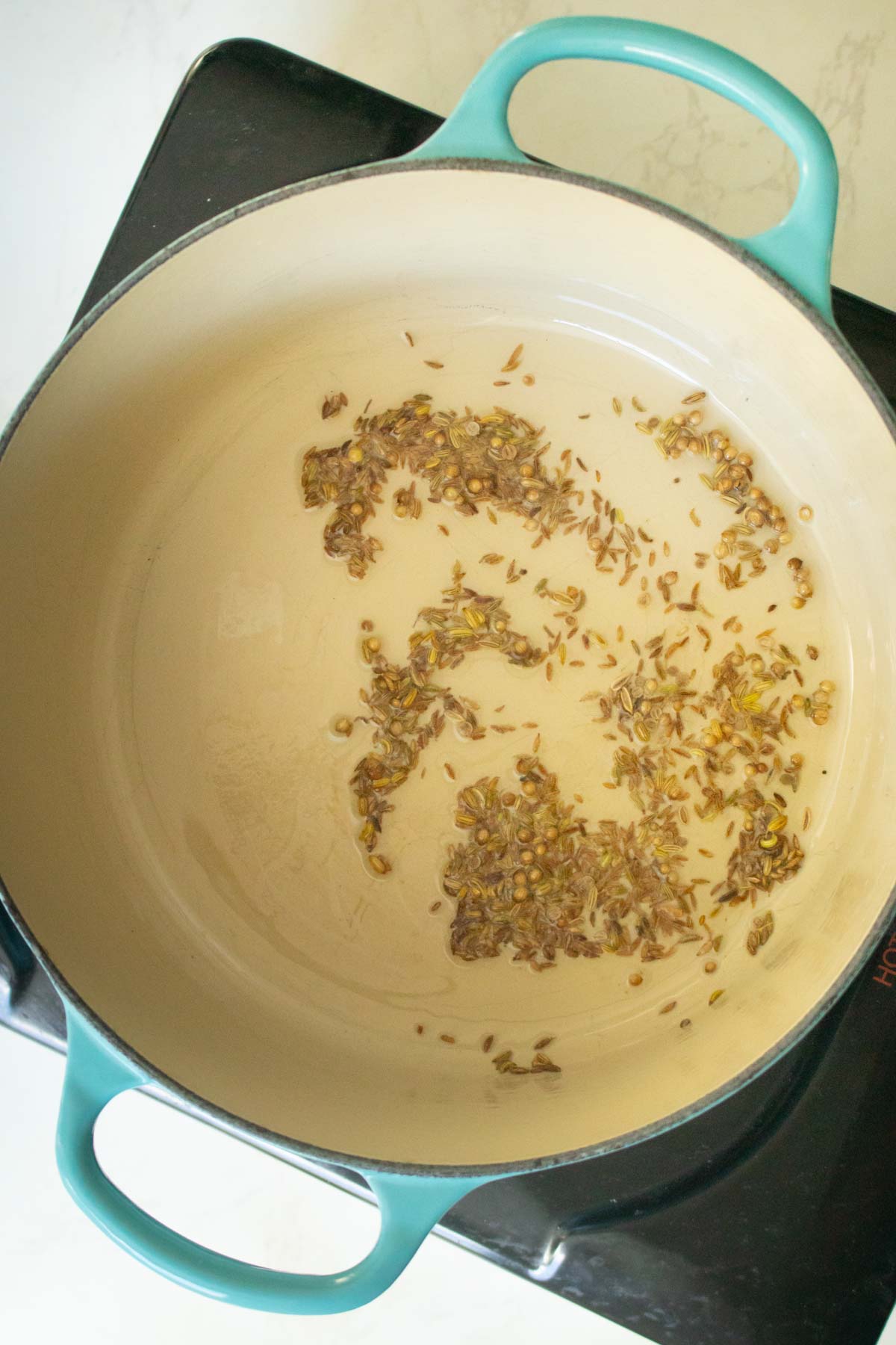 toasting the whole spices in the pan