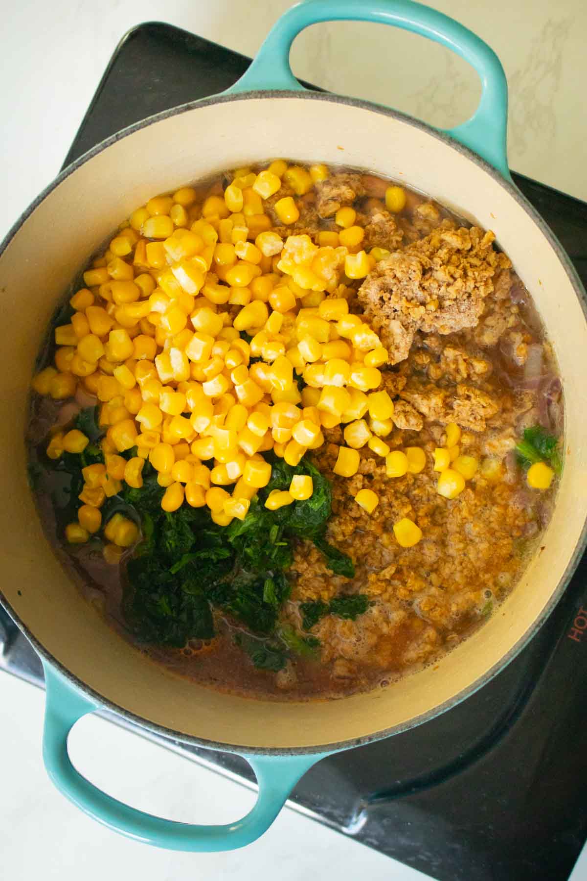 adding the remaining curry ingredients to the pan