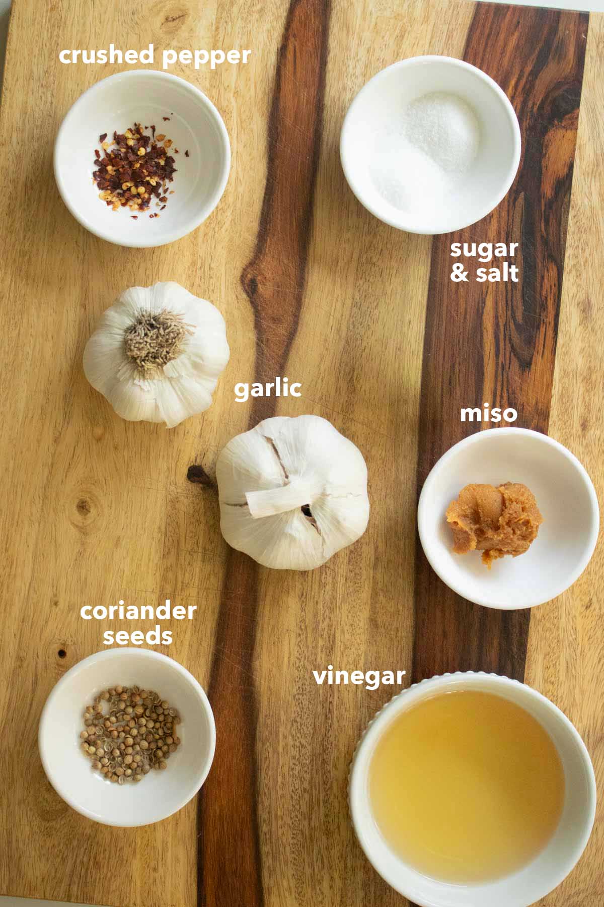 pickled garlic ingredients on a cutting board, text labels
