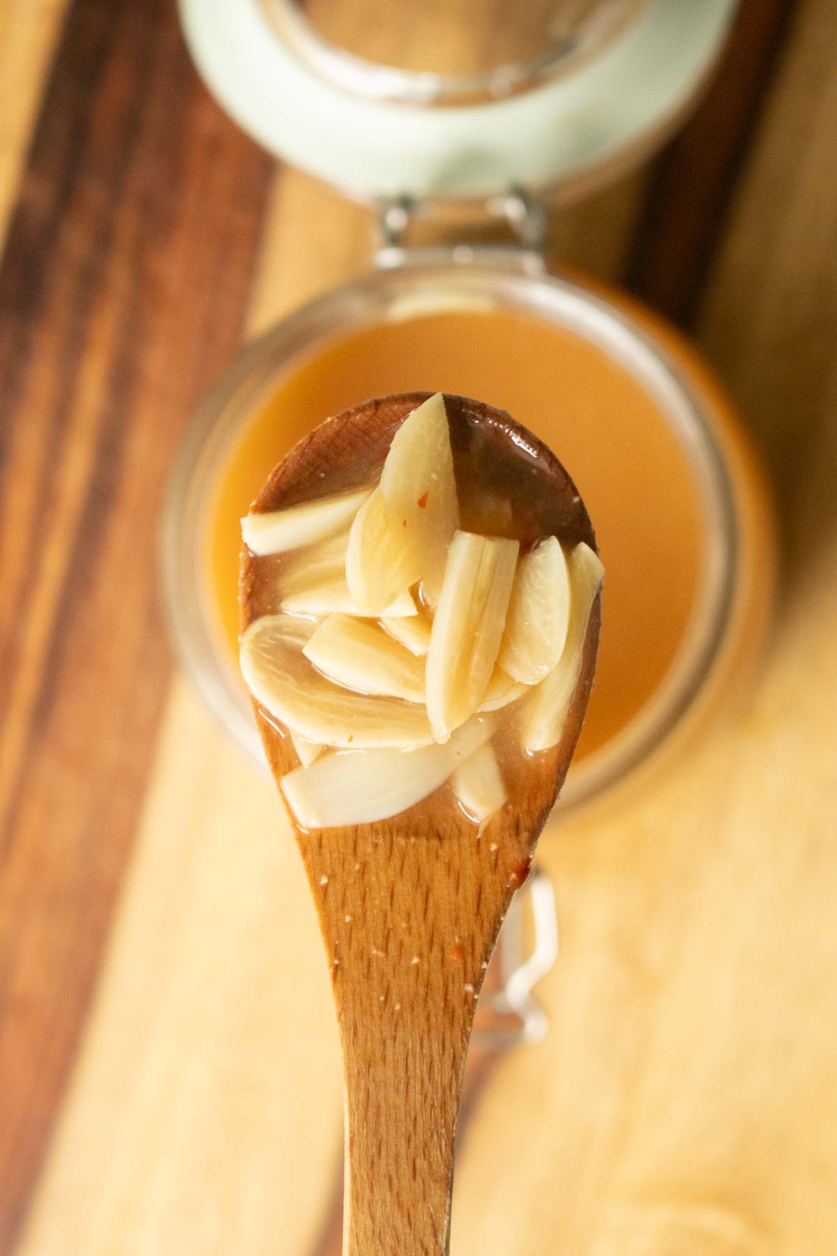 close-up of a spoonful of pickled garlic