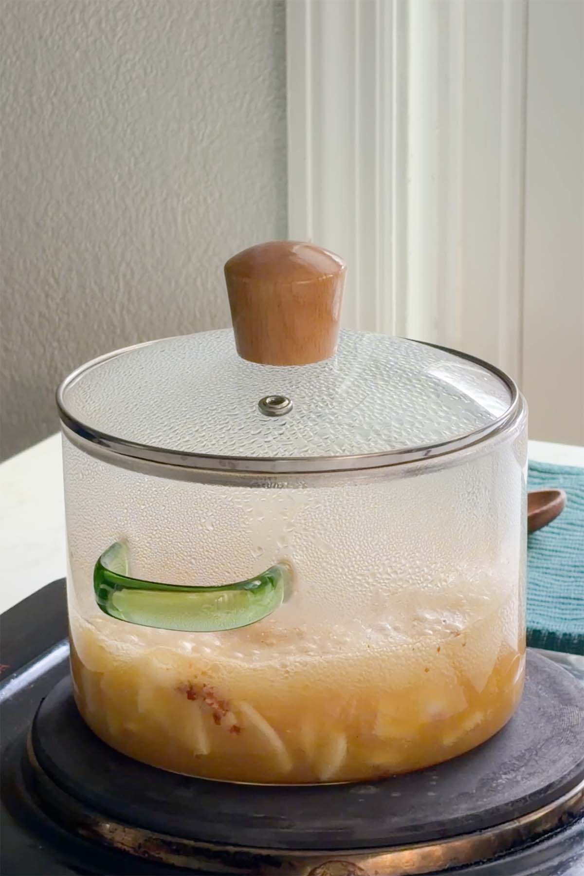 boiling the pickled garlic ingredients in the pan