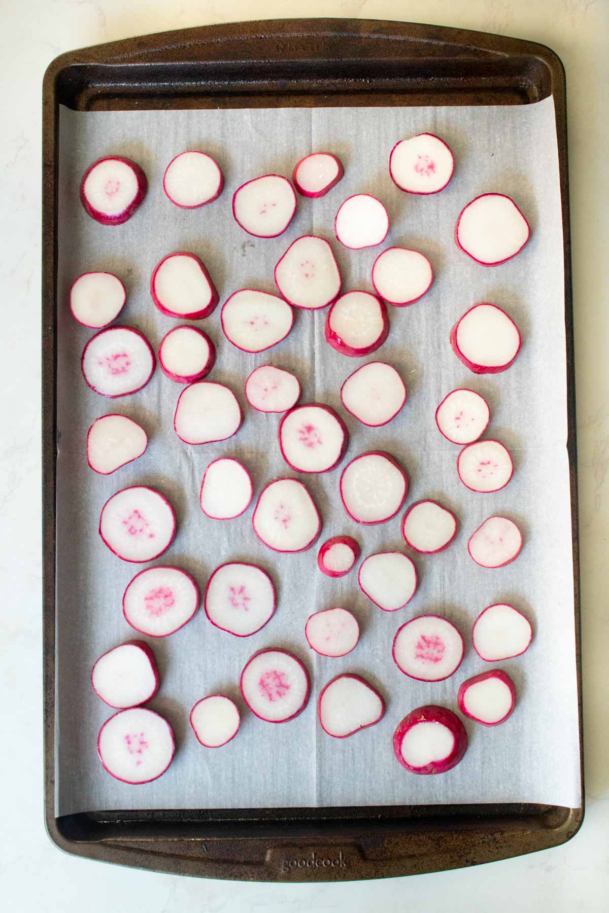radish slices on the baking sheet before baking