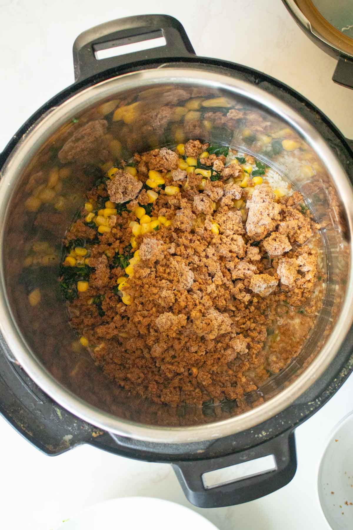 veggie rice ingredients in the Instant Pot before cooking