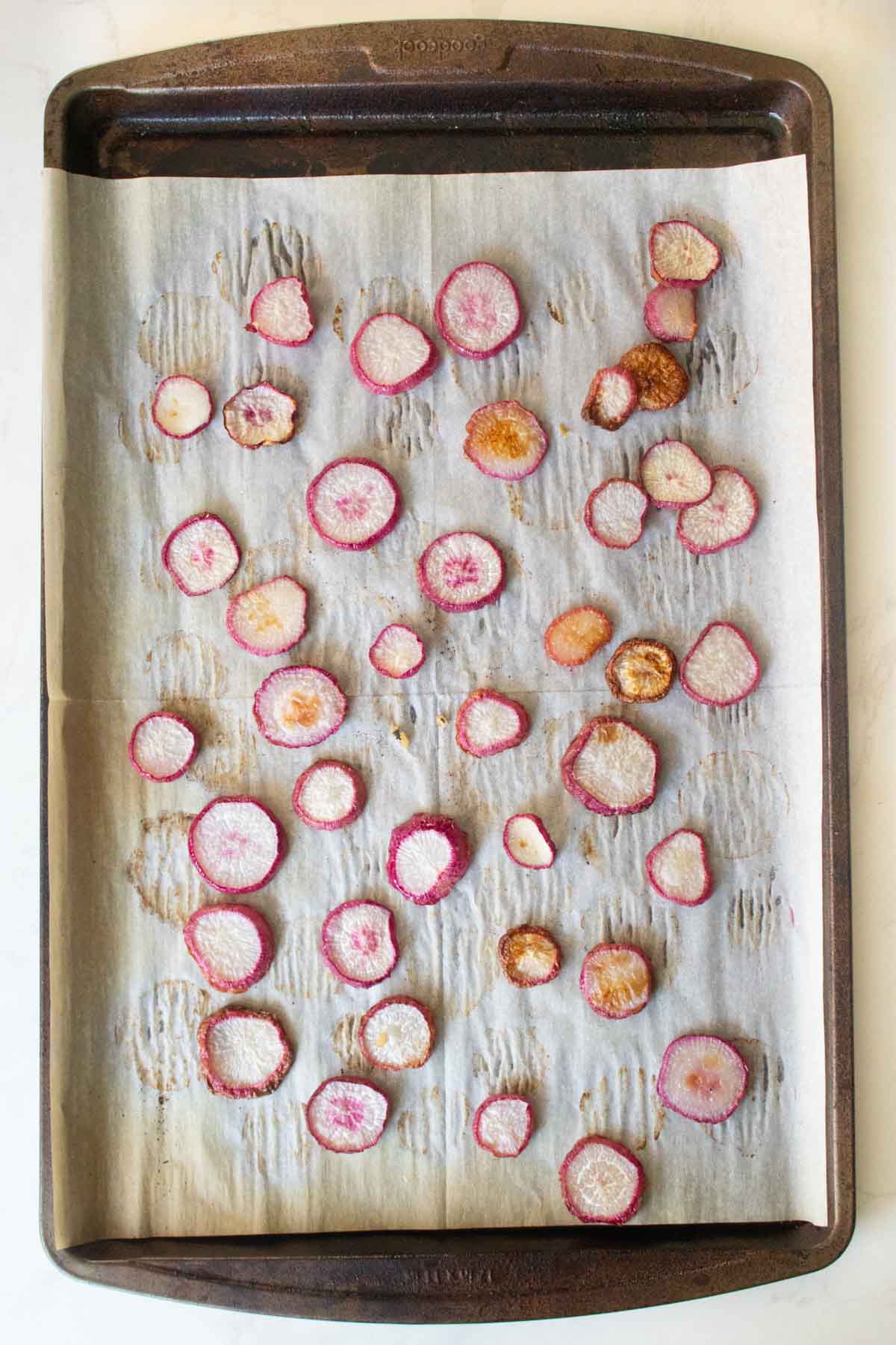 radish slices on the baking sheet after baking
