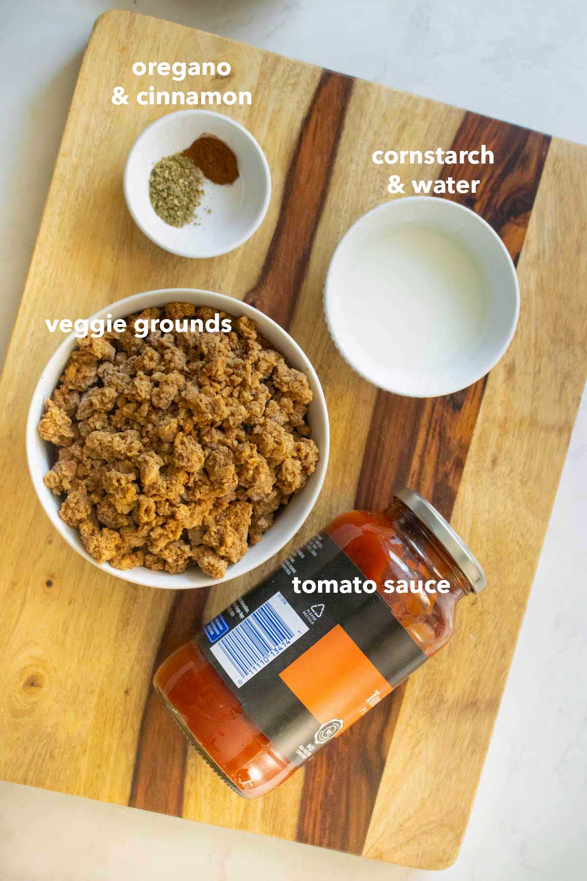 vegan meat sauce ingredients on the cutting board, text labels on each one