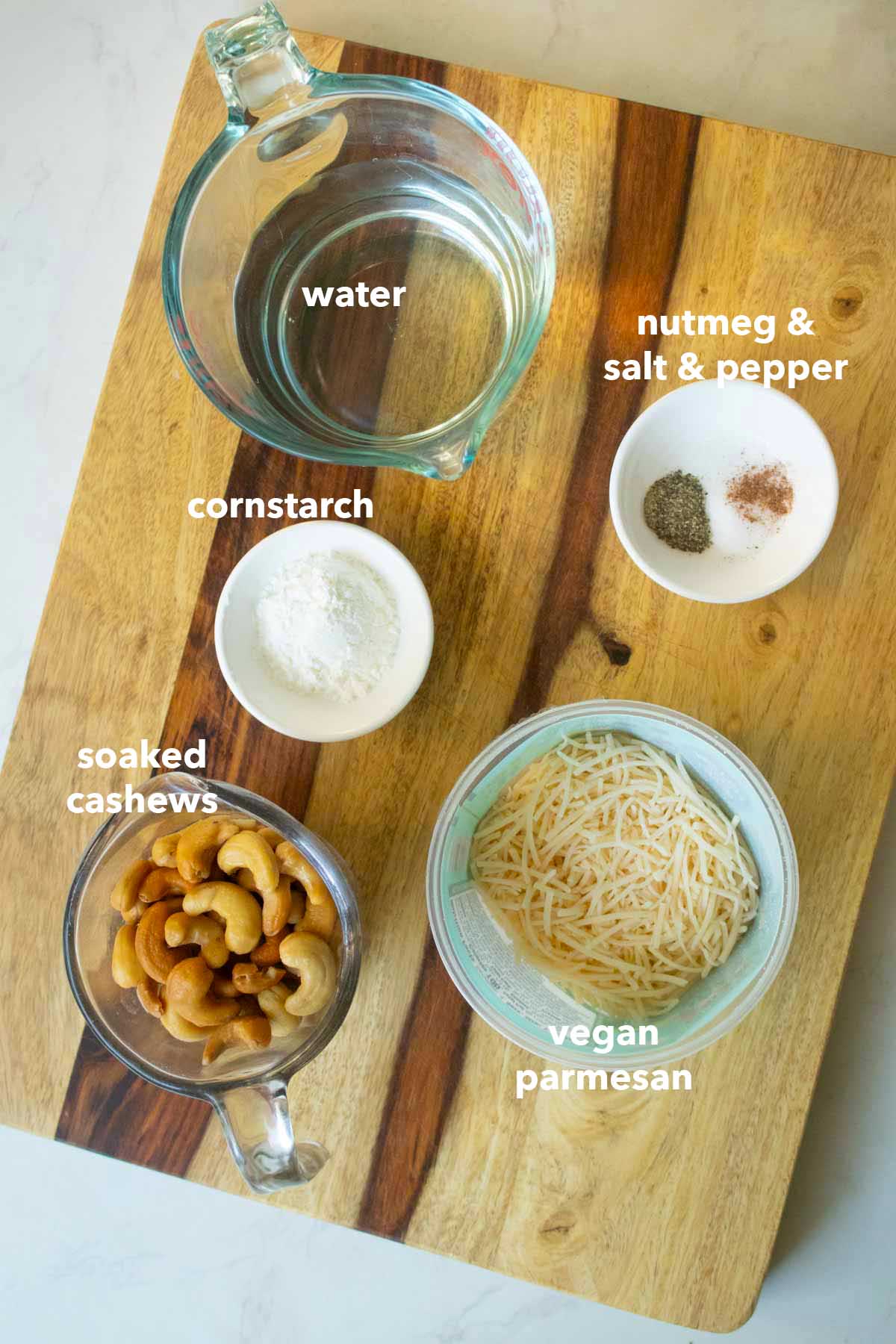 cashew cream ingredients on the cutting board, text labels on each one