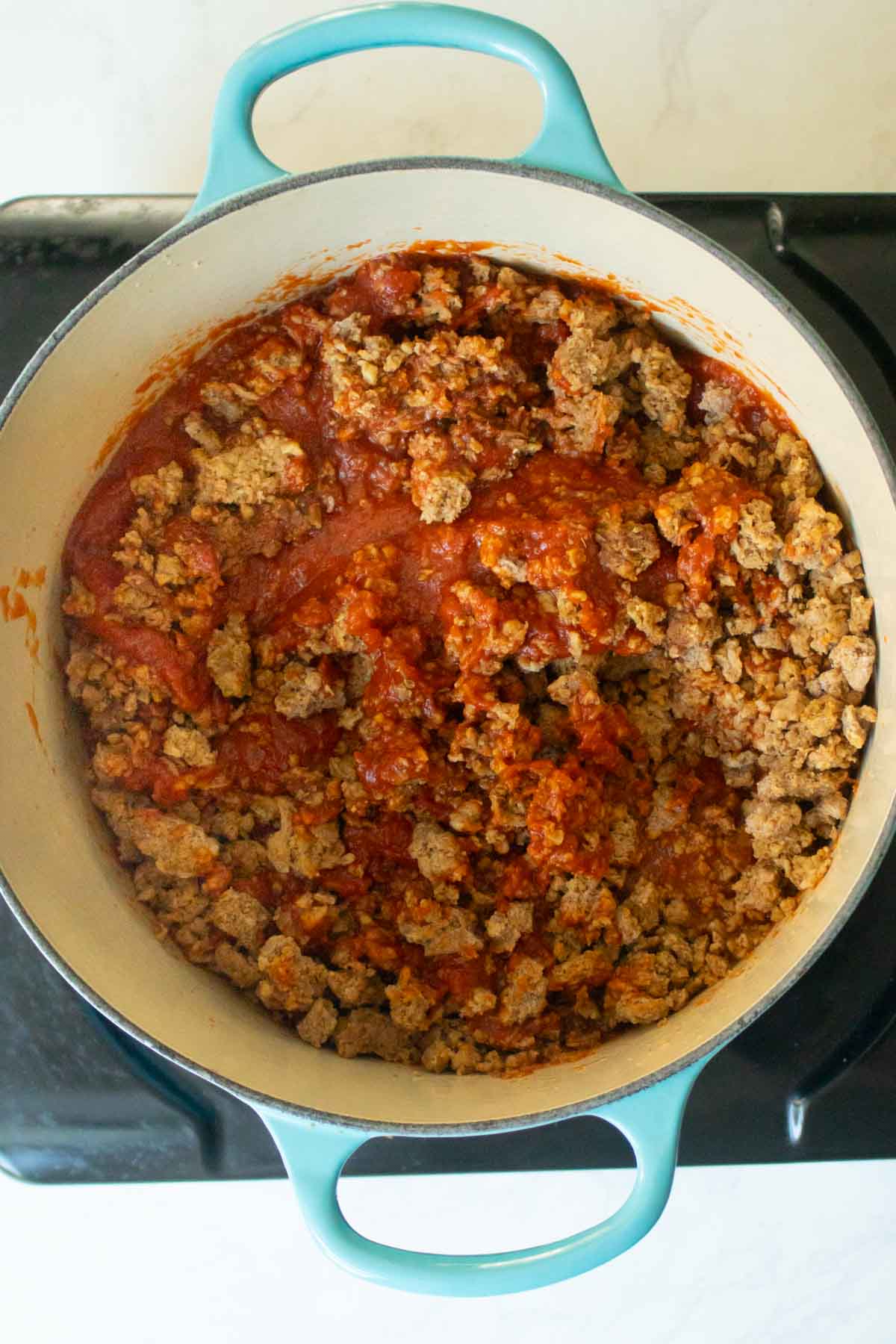 meat sauce ingredients in the pan before cooking