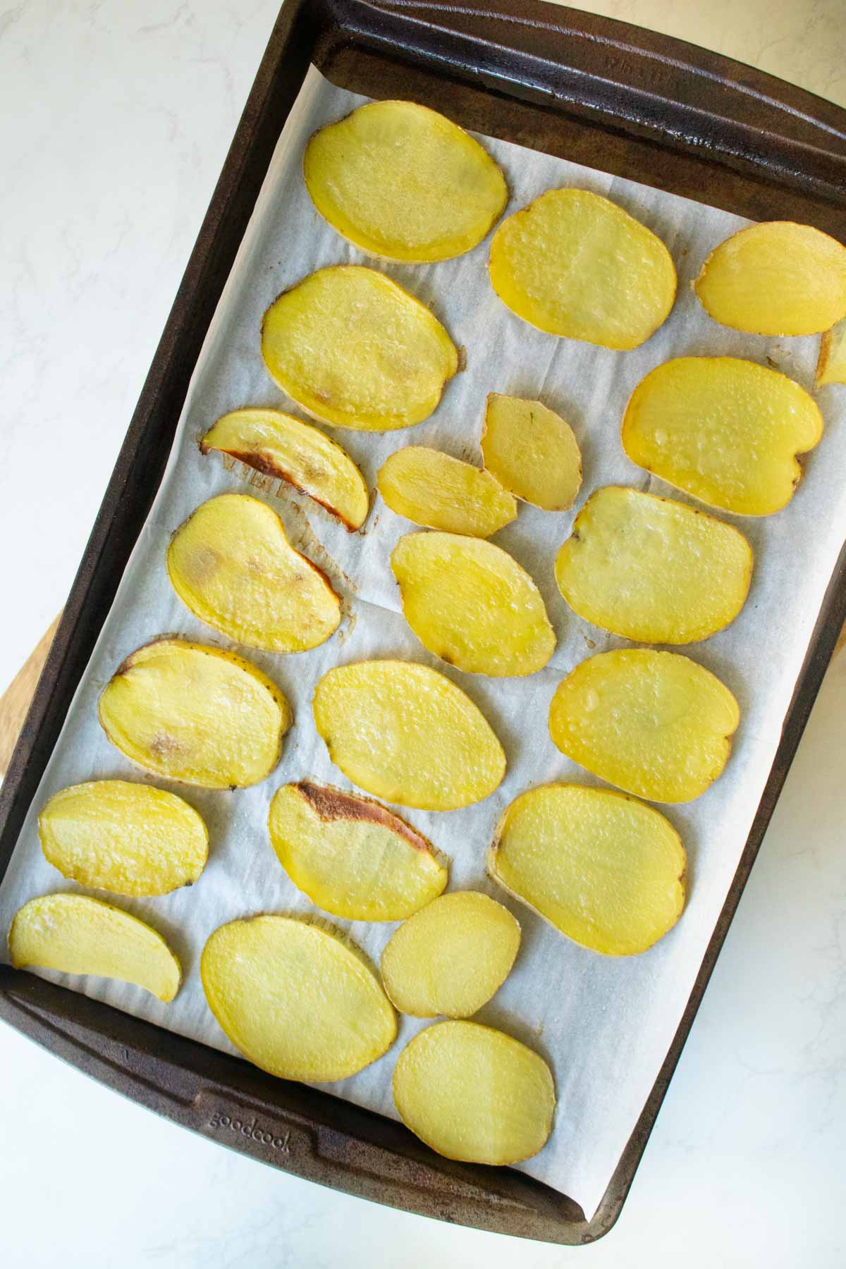 sliced potato on the baking sheet after baking