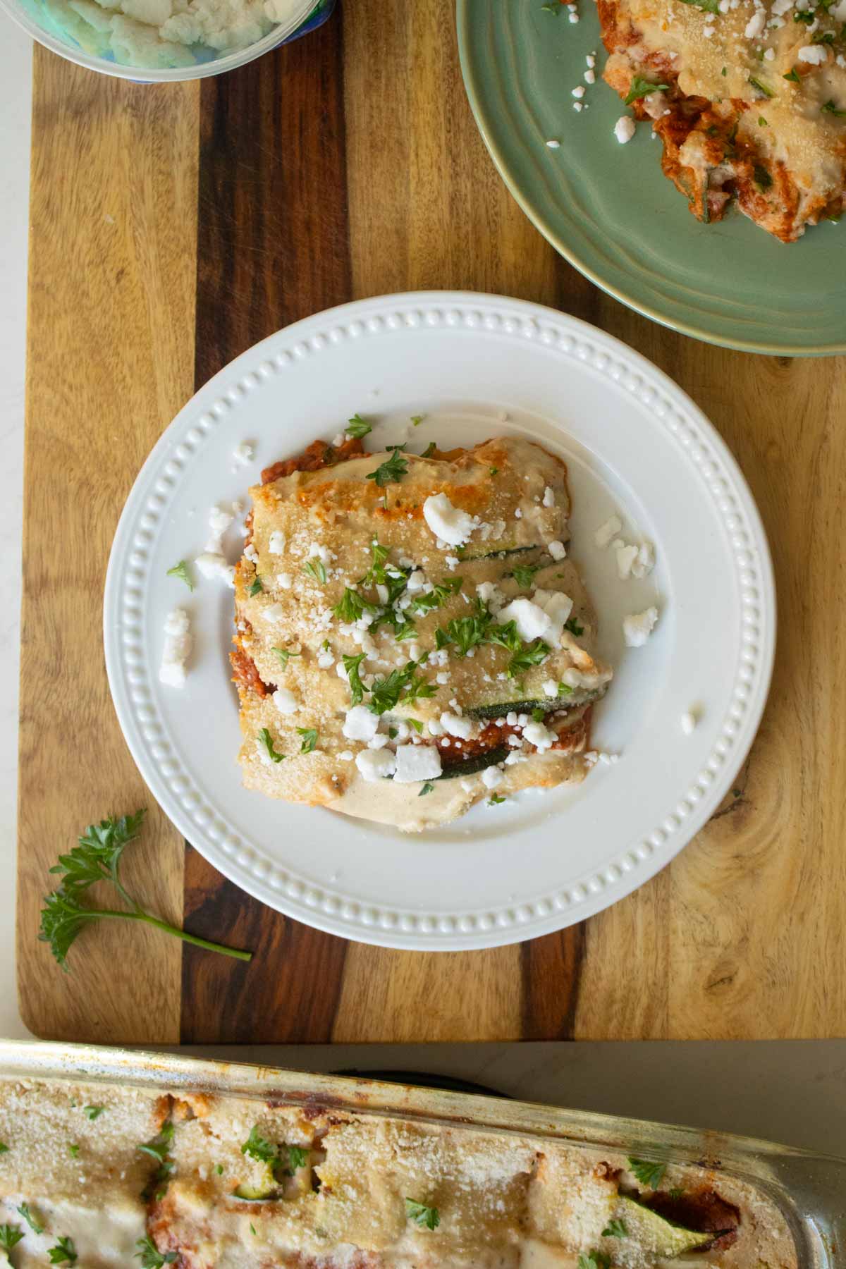 plates of zucchini moussaka on a wooden table