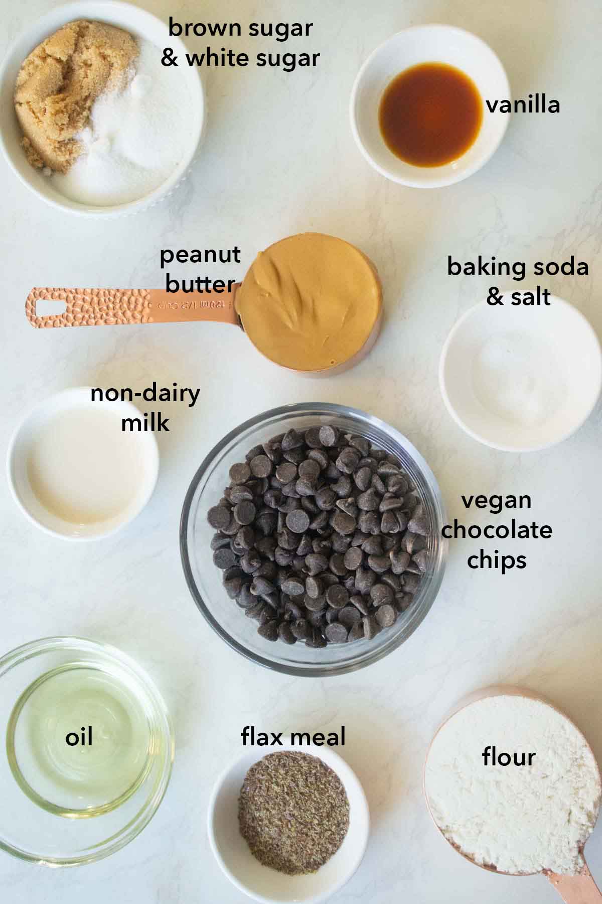 vegan peanut butter chocolate cookie ingredients on a white kitchen counter