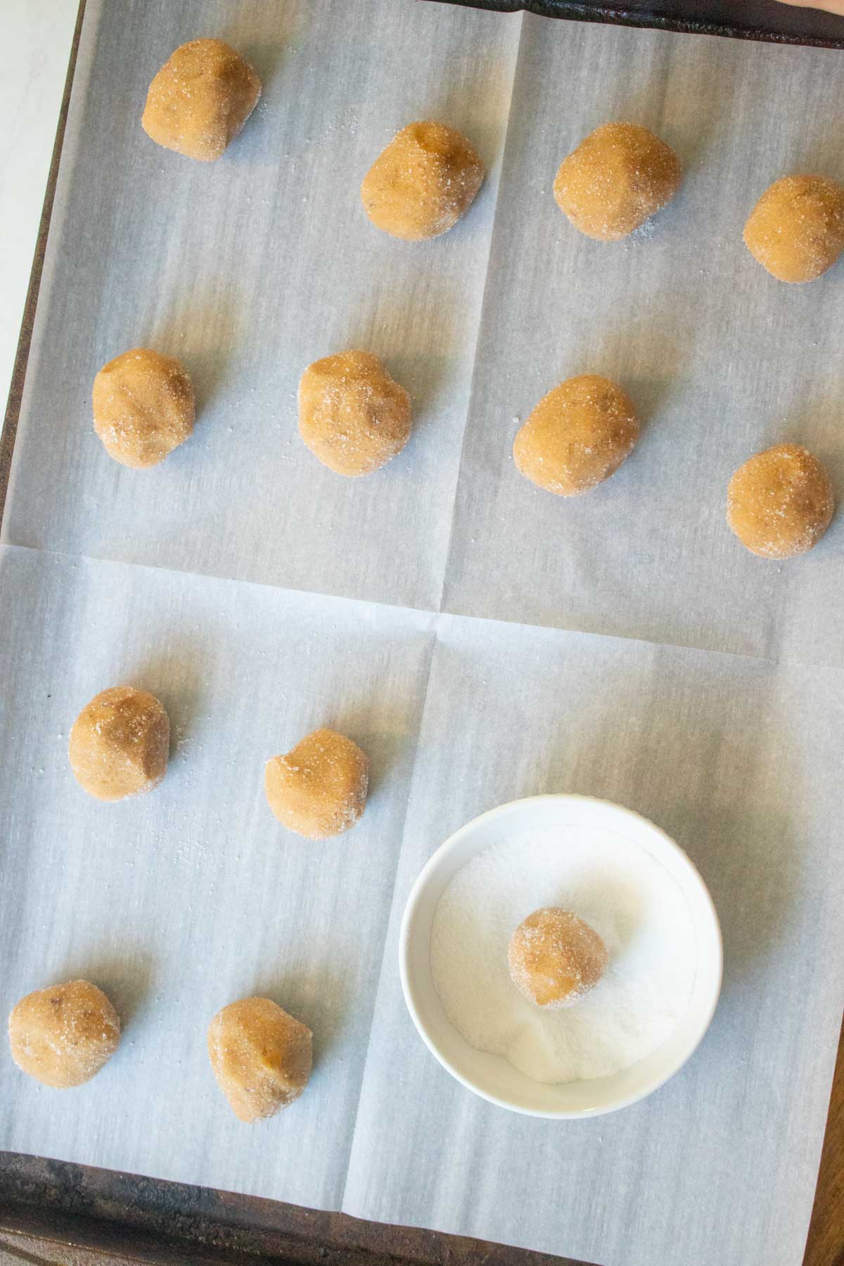 dredging the cookies in sugar