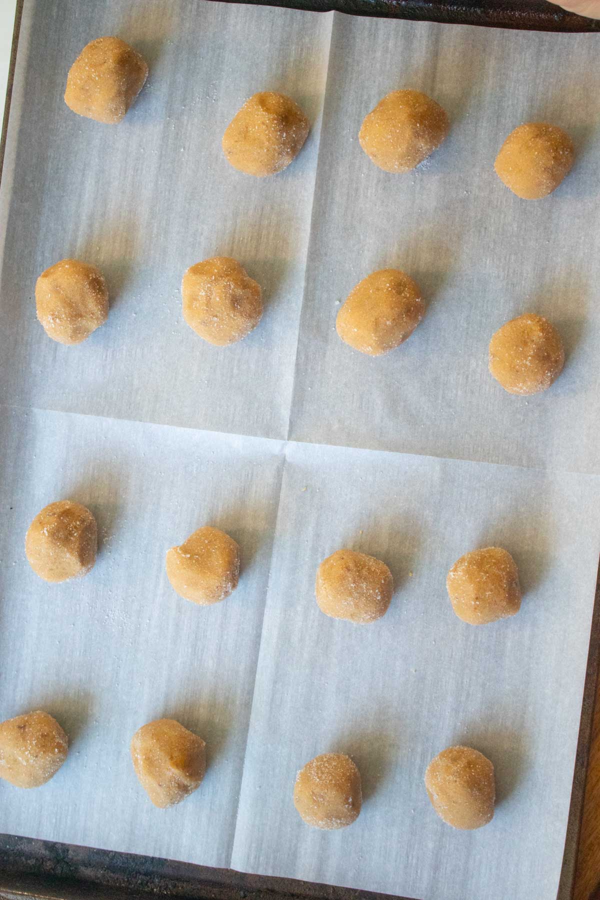 vegan peanut butter chocolate cookies on the cookie sheet before pressing