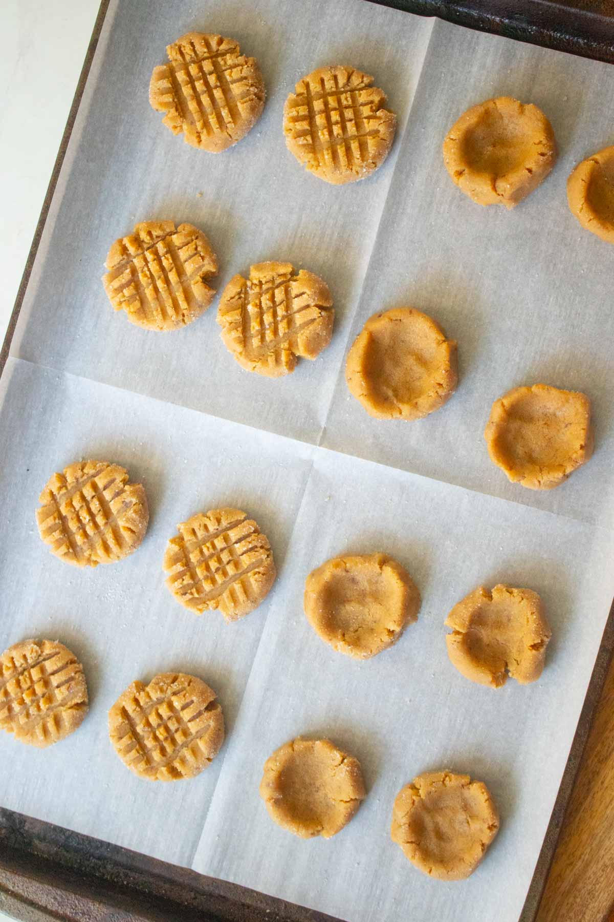 vegan peanut butter chocolate cookies on the cookie sheet after pressing