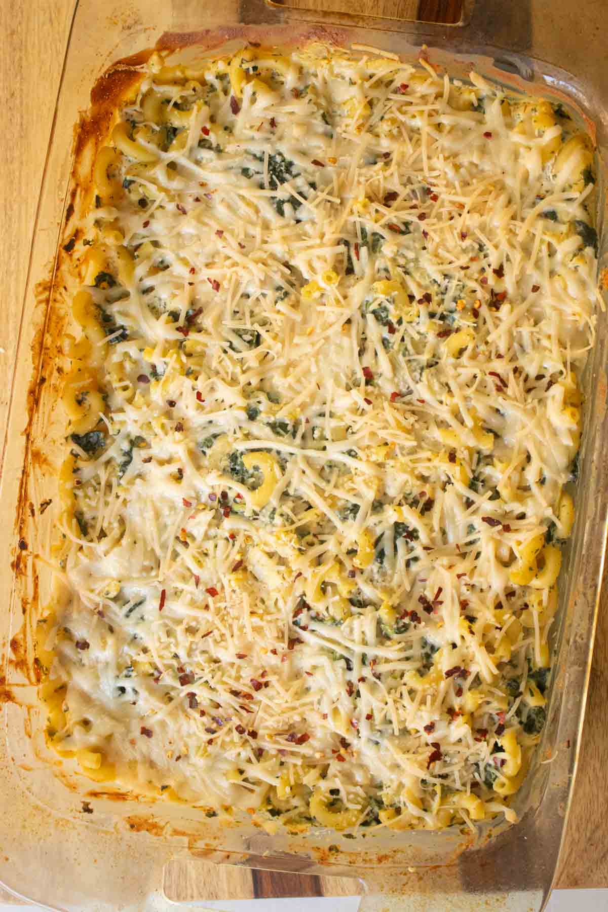 pan of spinach artichoke mac and cheese after baking