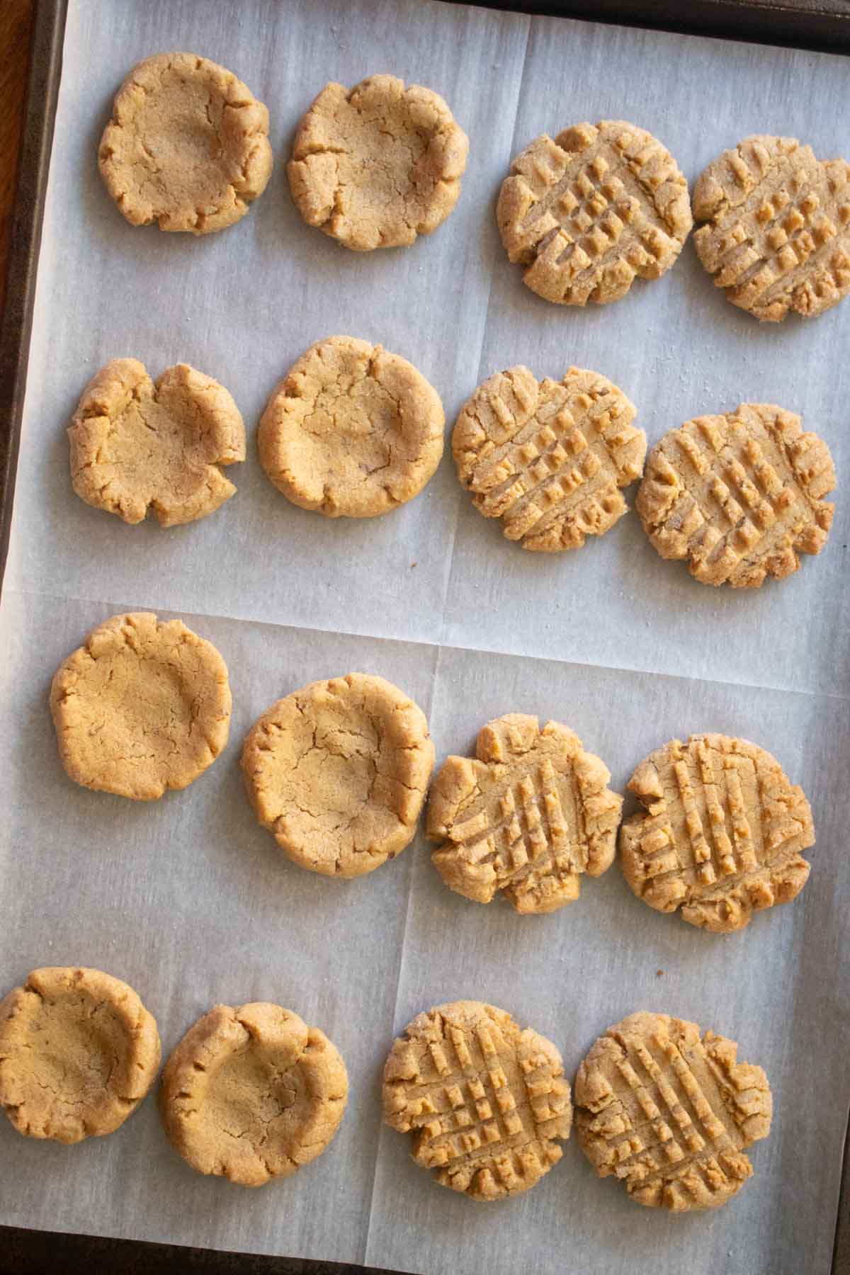 peanut butter chocolate cookies on the baking sheet before adding the chocolate