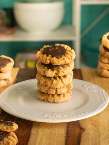 close-up of peanut butter chocolate cookies stacked on a plate