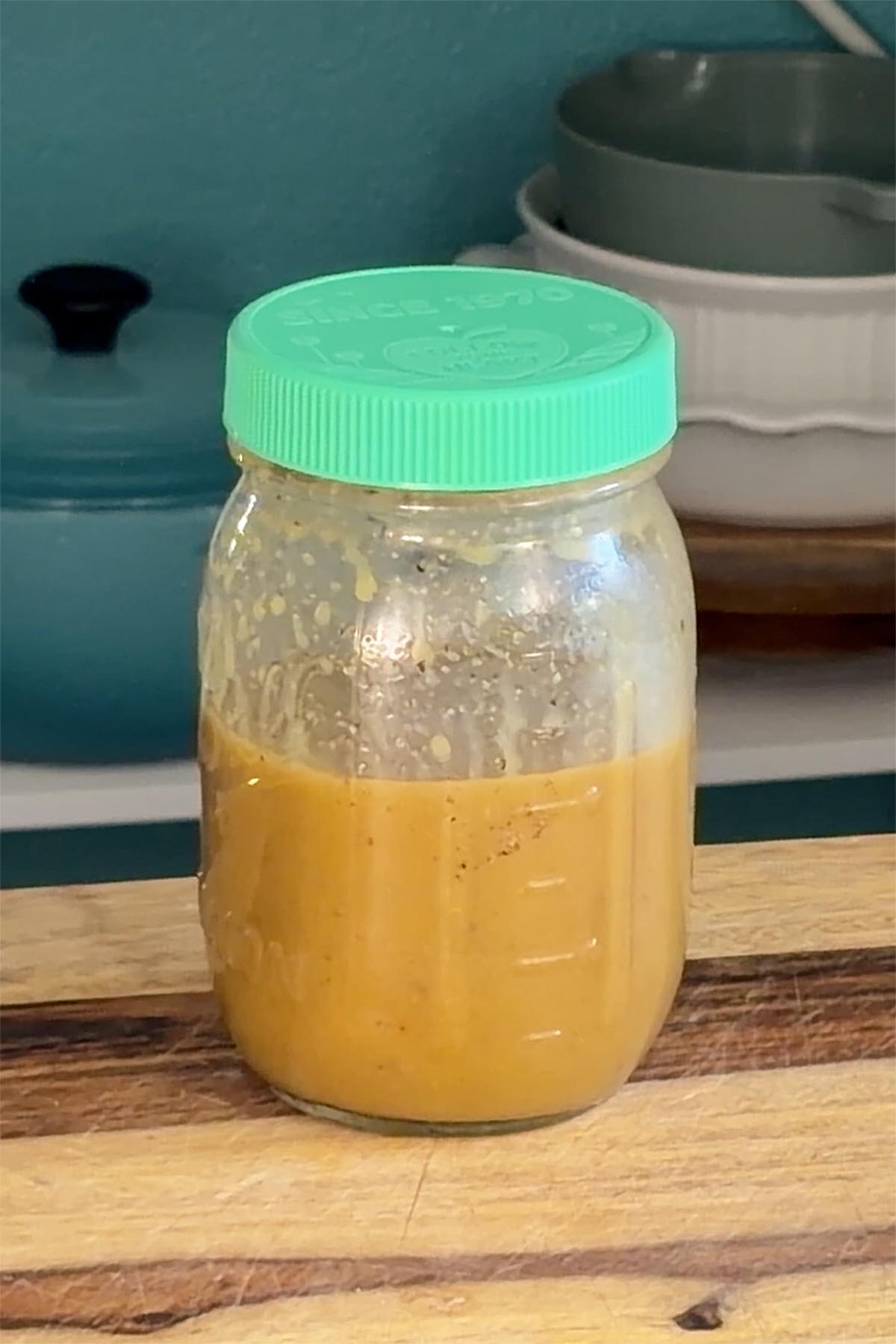 maple mustard dressing ingredients in the jar after mixing