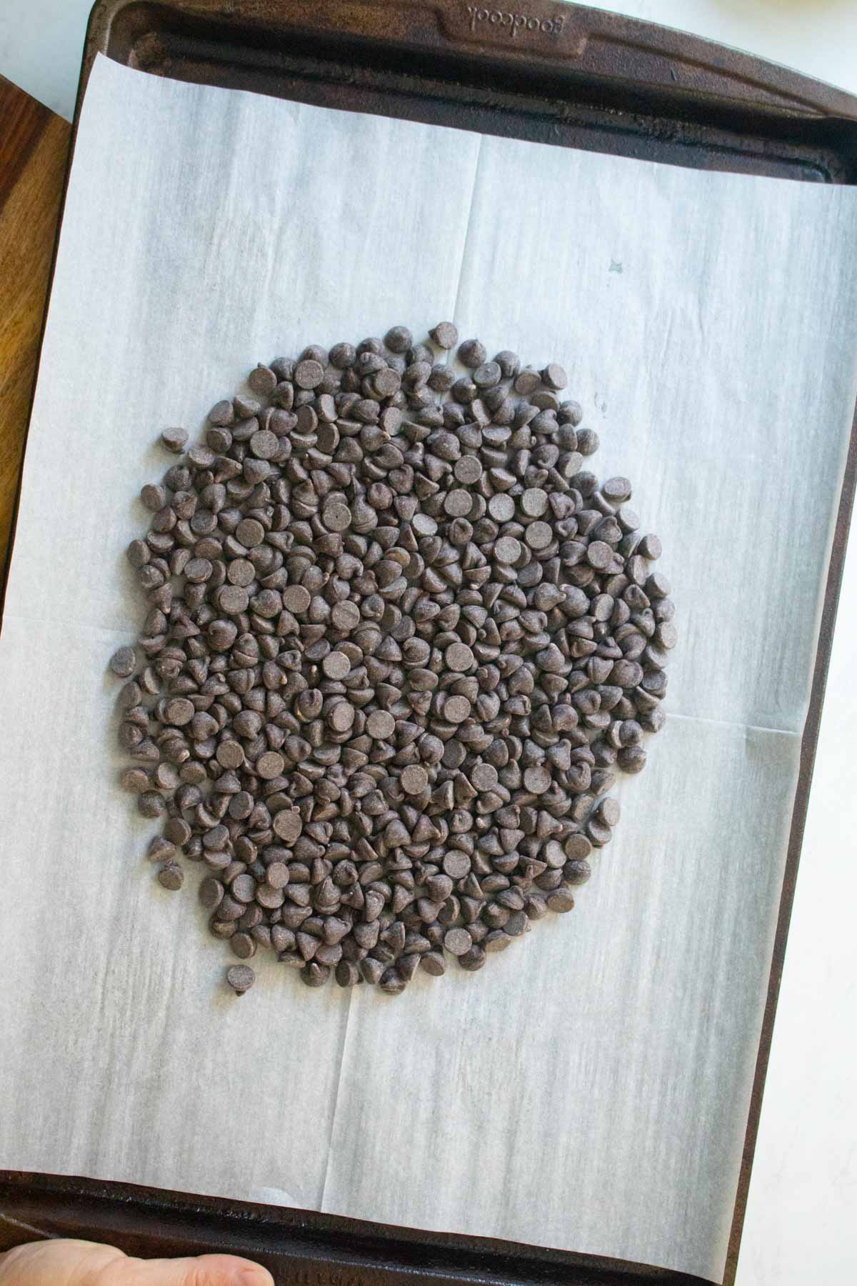 chocolate chips on the baking sheet before melting