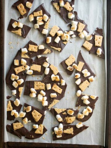 s'mores bark on the baking sheet after breaking it into pieces
